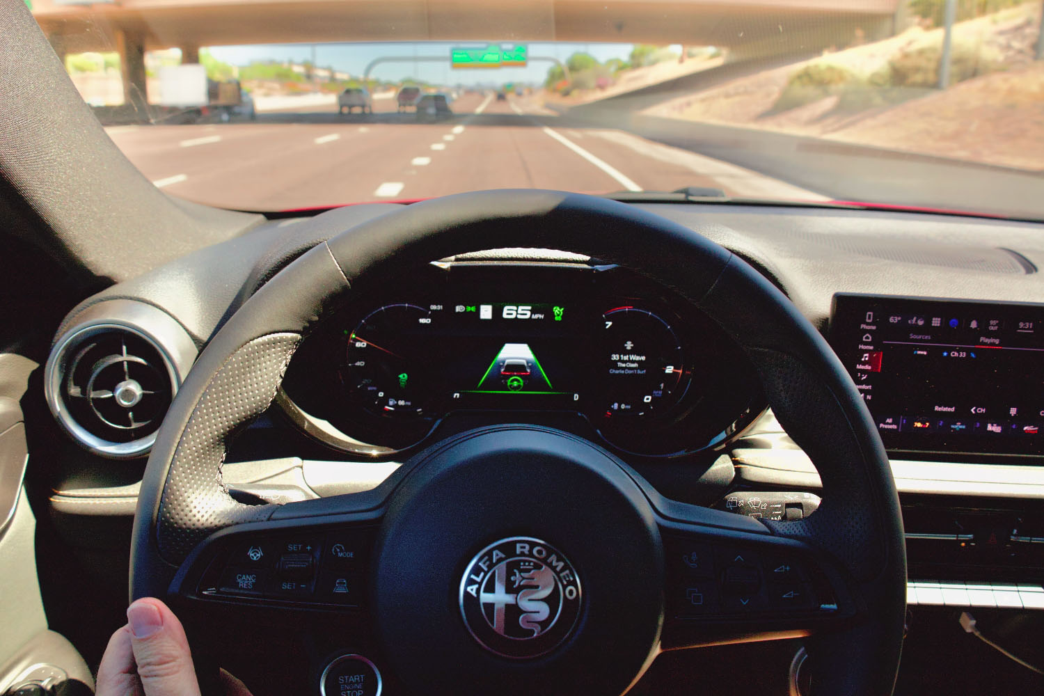 Steering wheel and gauge cluster displaying Active Driving Assist information in the 2024 Alfa Romeo Tonale