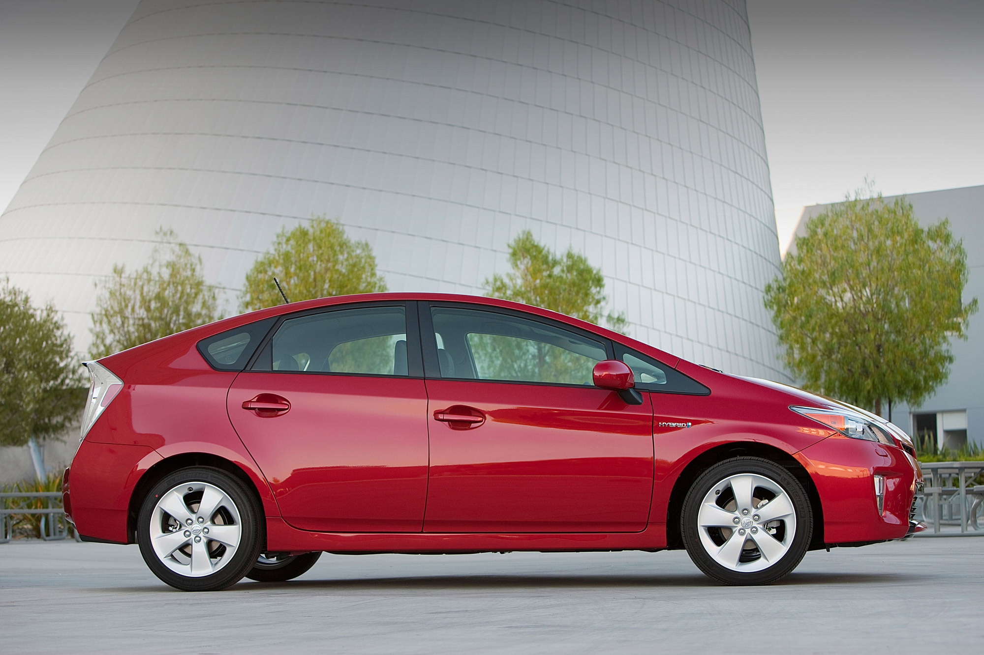 Side view of a red 2012 Toyota Prius