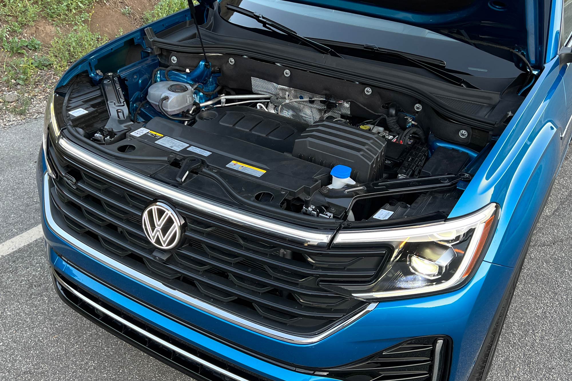 Engine bay of a blue 2024 Volkswagen Atlas Cross Sport