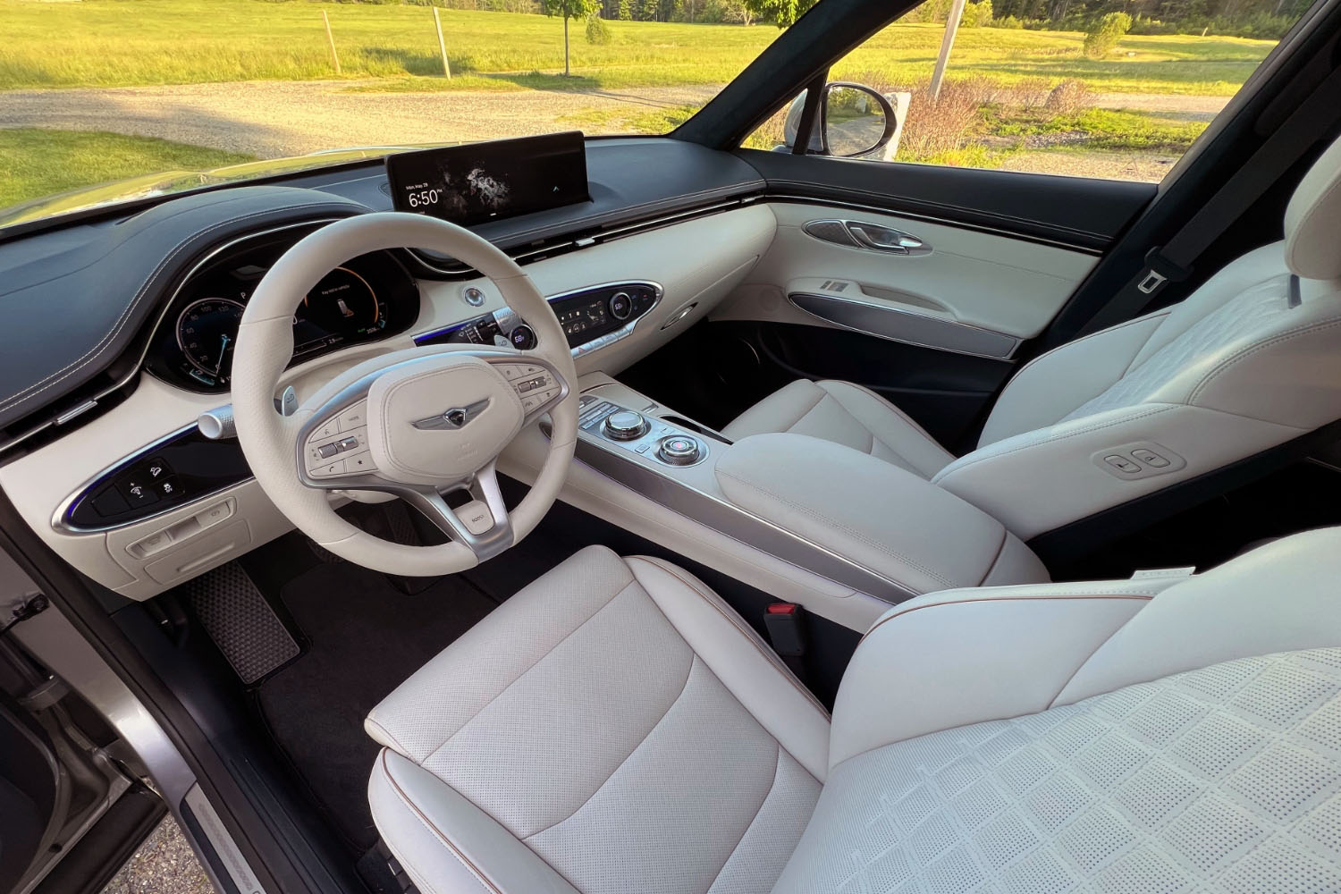 2023 Genesis Electrified GV70 interior, dashboard, and front seats.
