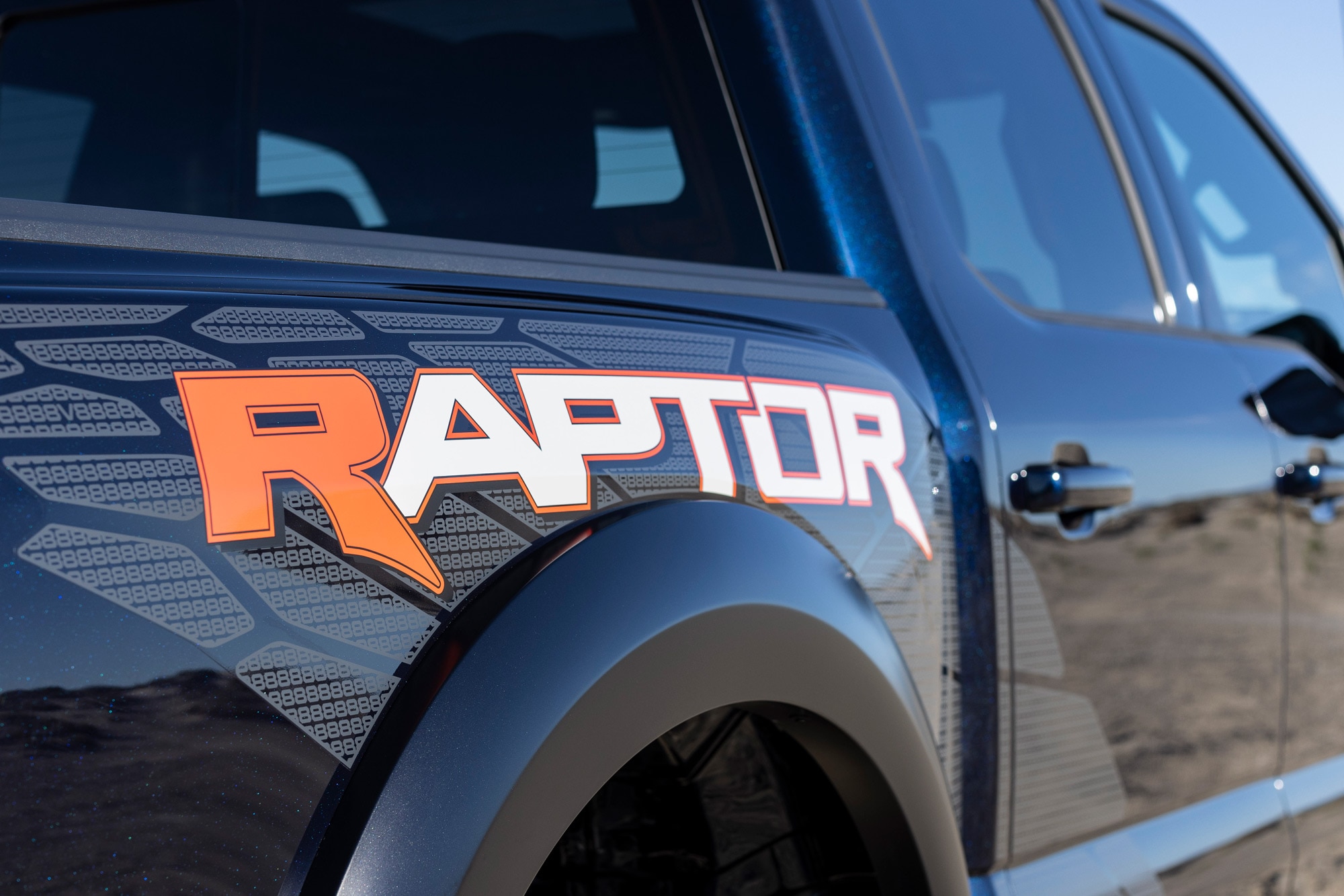 Close-up of the logo on a black 2023 Ford F-150 Raptor R