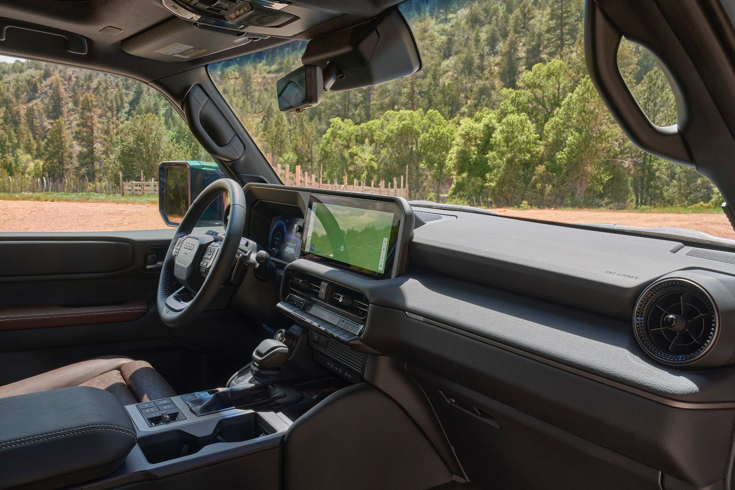 2024 Toyota Land Cruiser interior and infotainment screen.