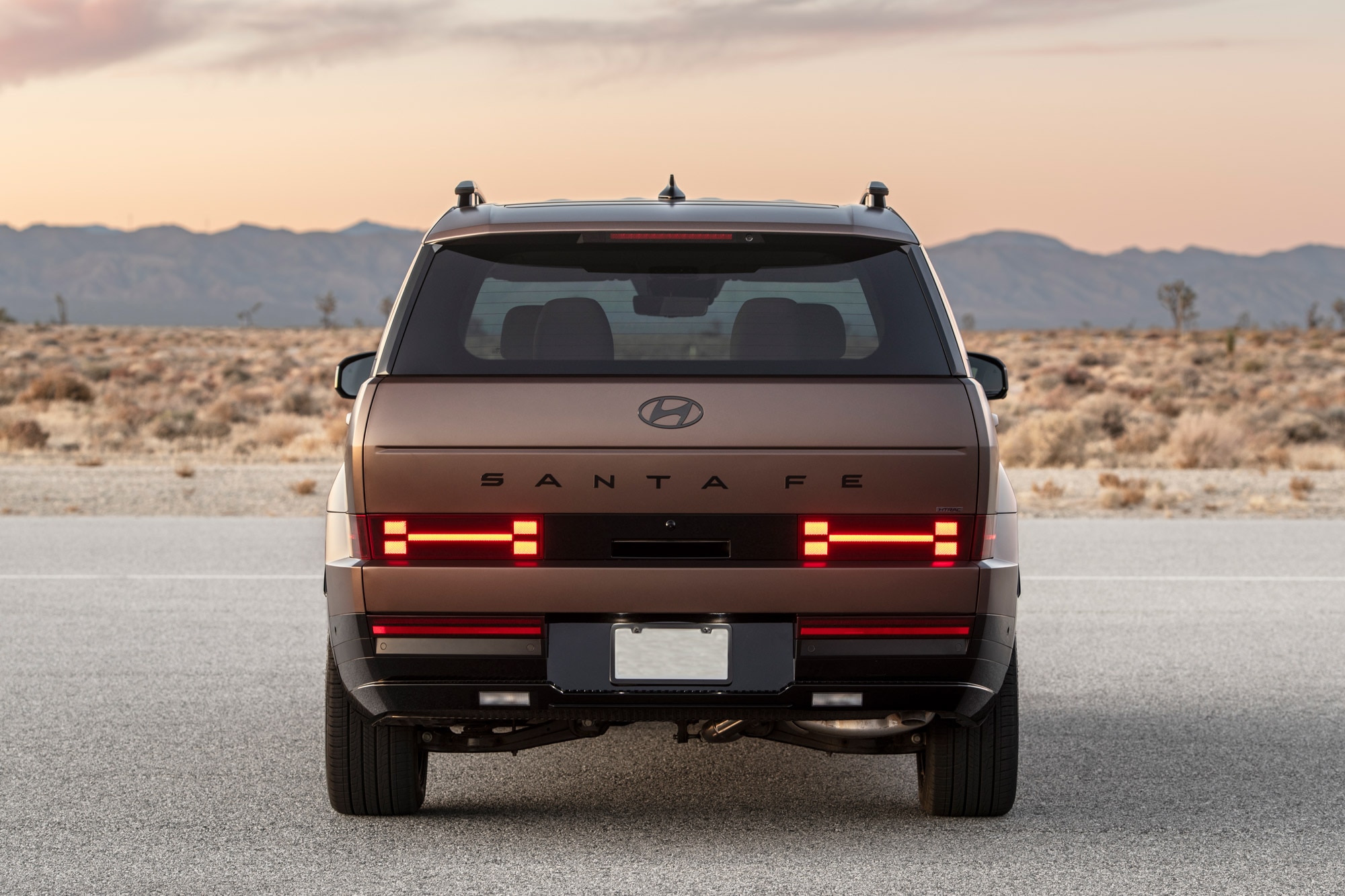 Rear view of a brown 2024 Hyundai Santa Fe