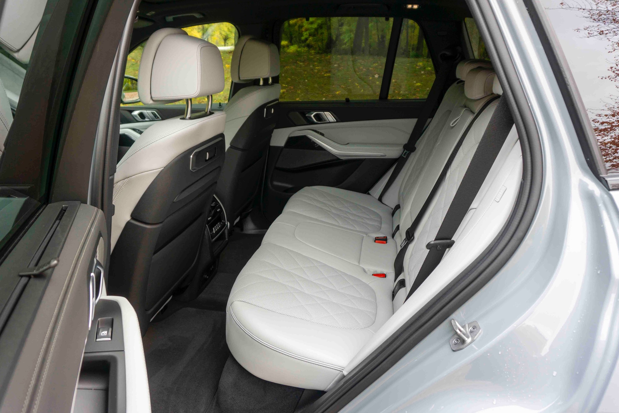 Grey 2024 BMW X5 xDrive50e rear passenger interior