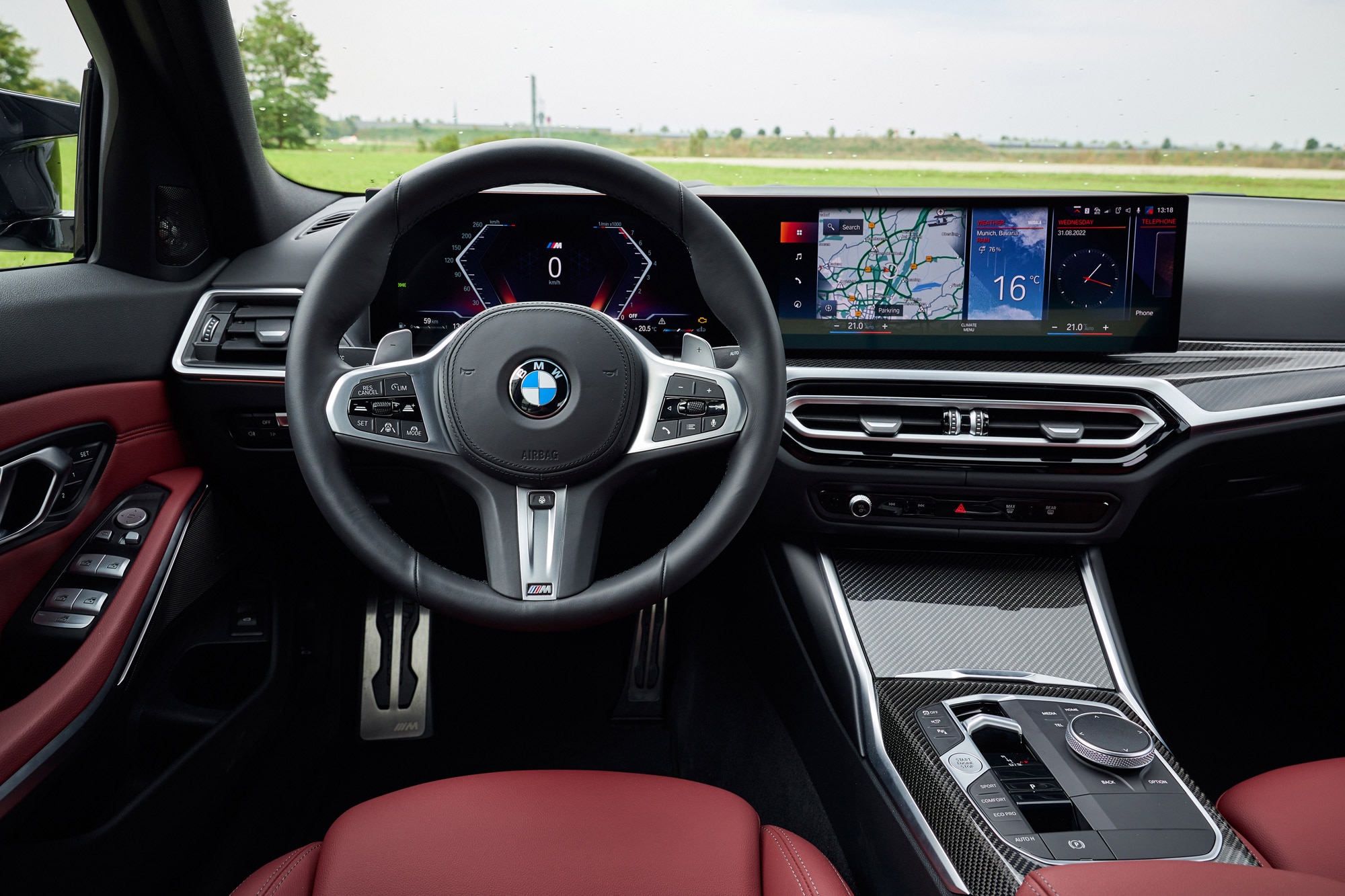 2023 M340i xDrive interior dashboard and red seats