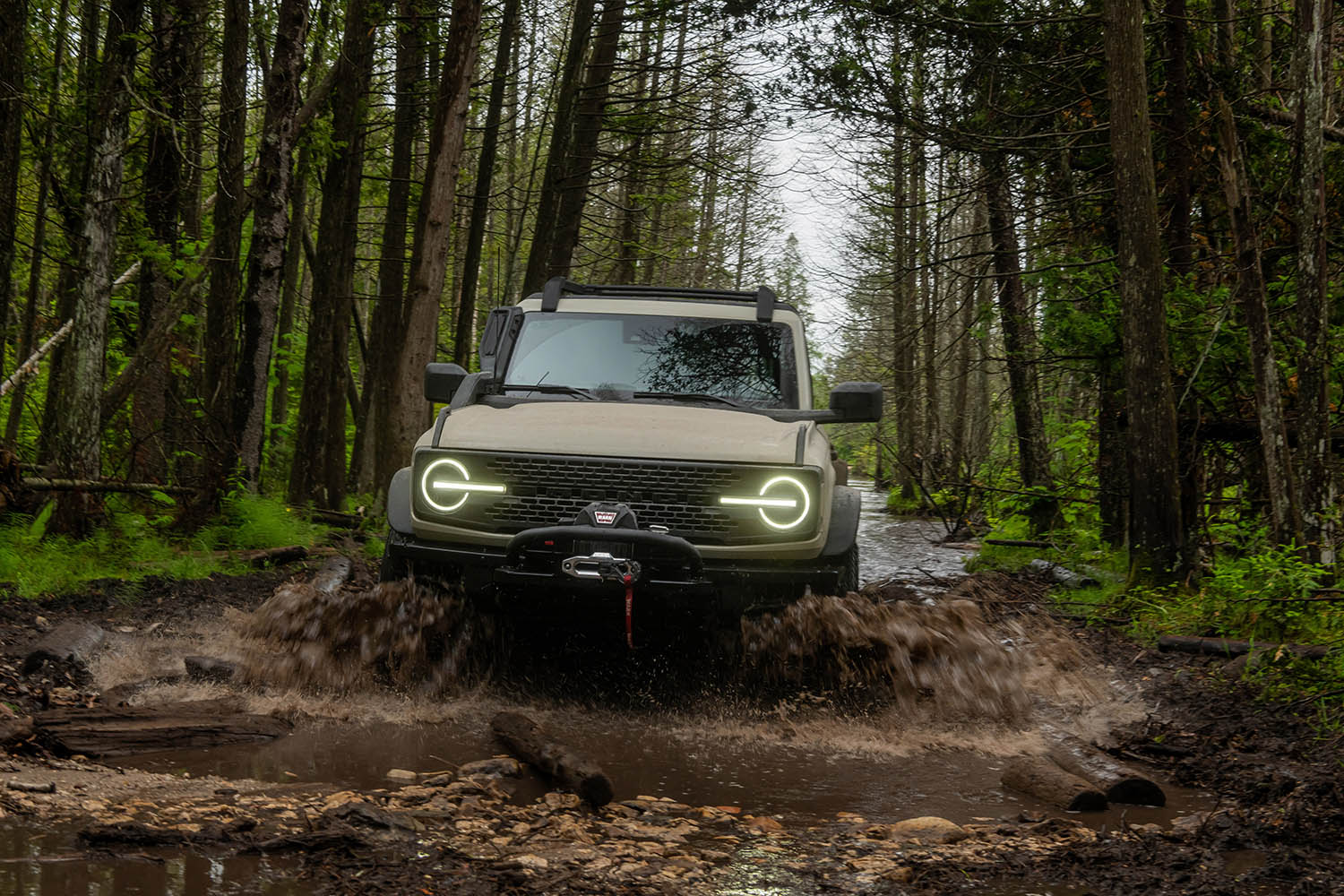 Ford Bronco driving through muddy water
