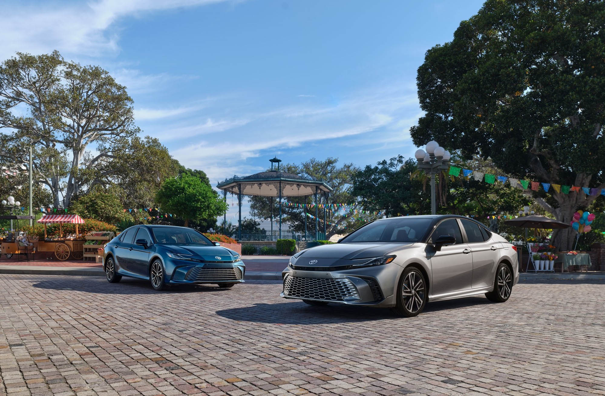 2025 Toyota Camrys in blue and gray at an amusement park