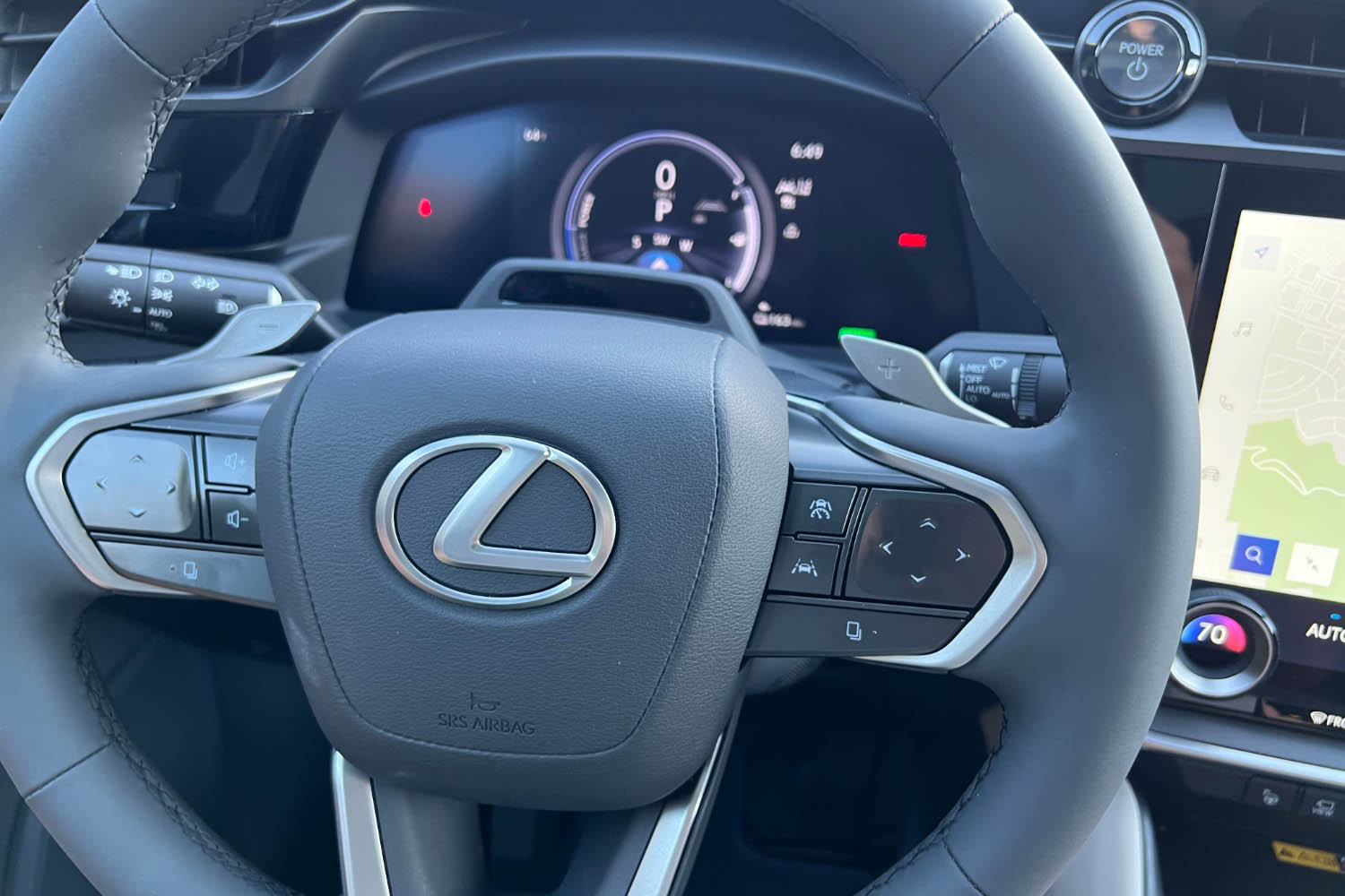 The steering wheel and gauge cluster of a 2023 Lexus RZ