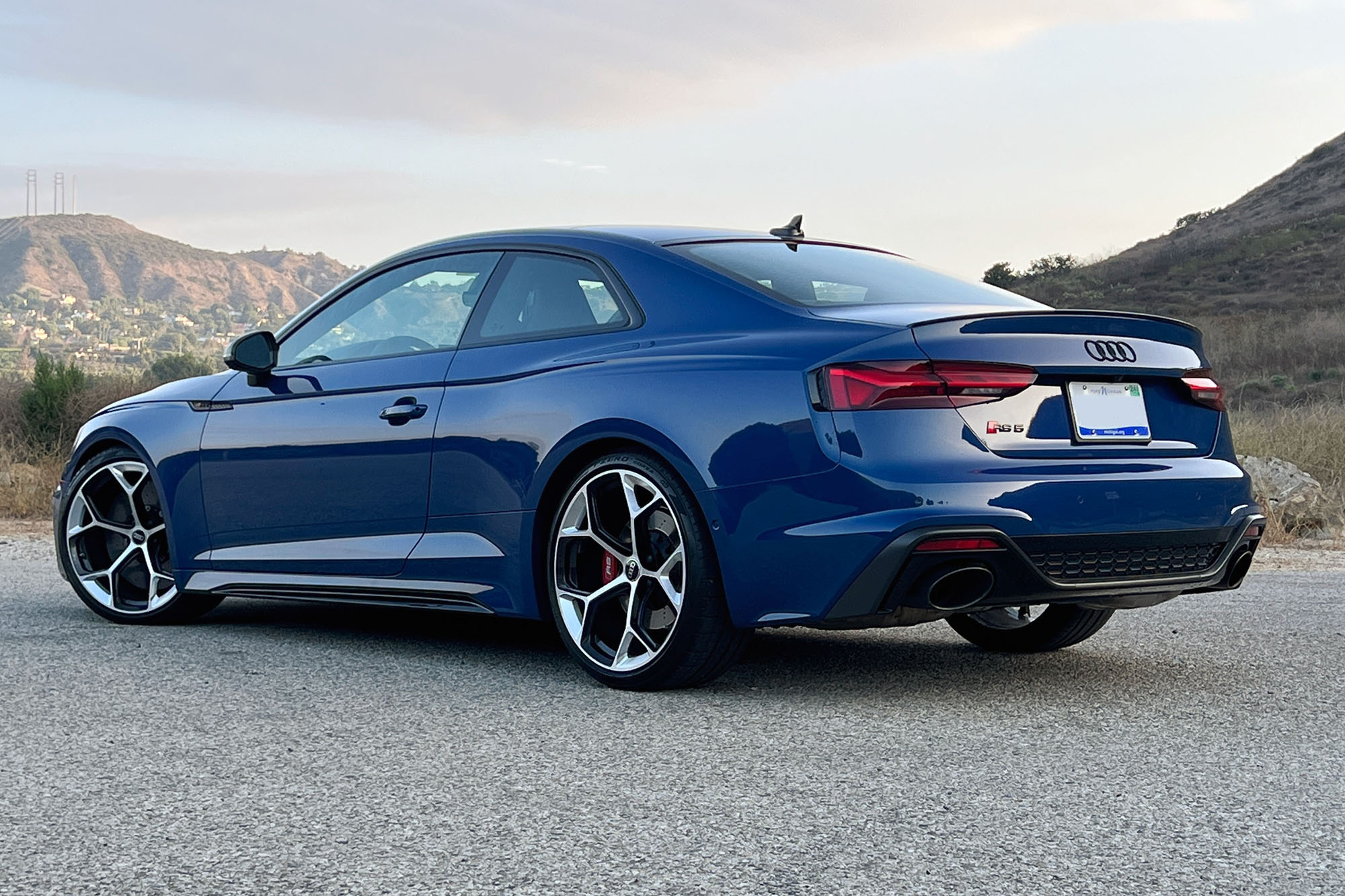  Rear left view of a blue 2023 Audi RS 5 