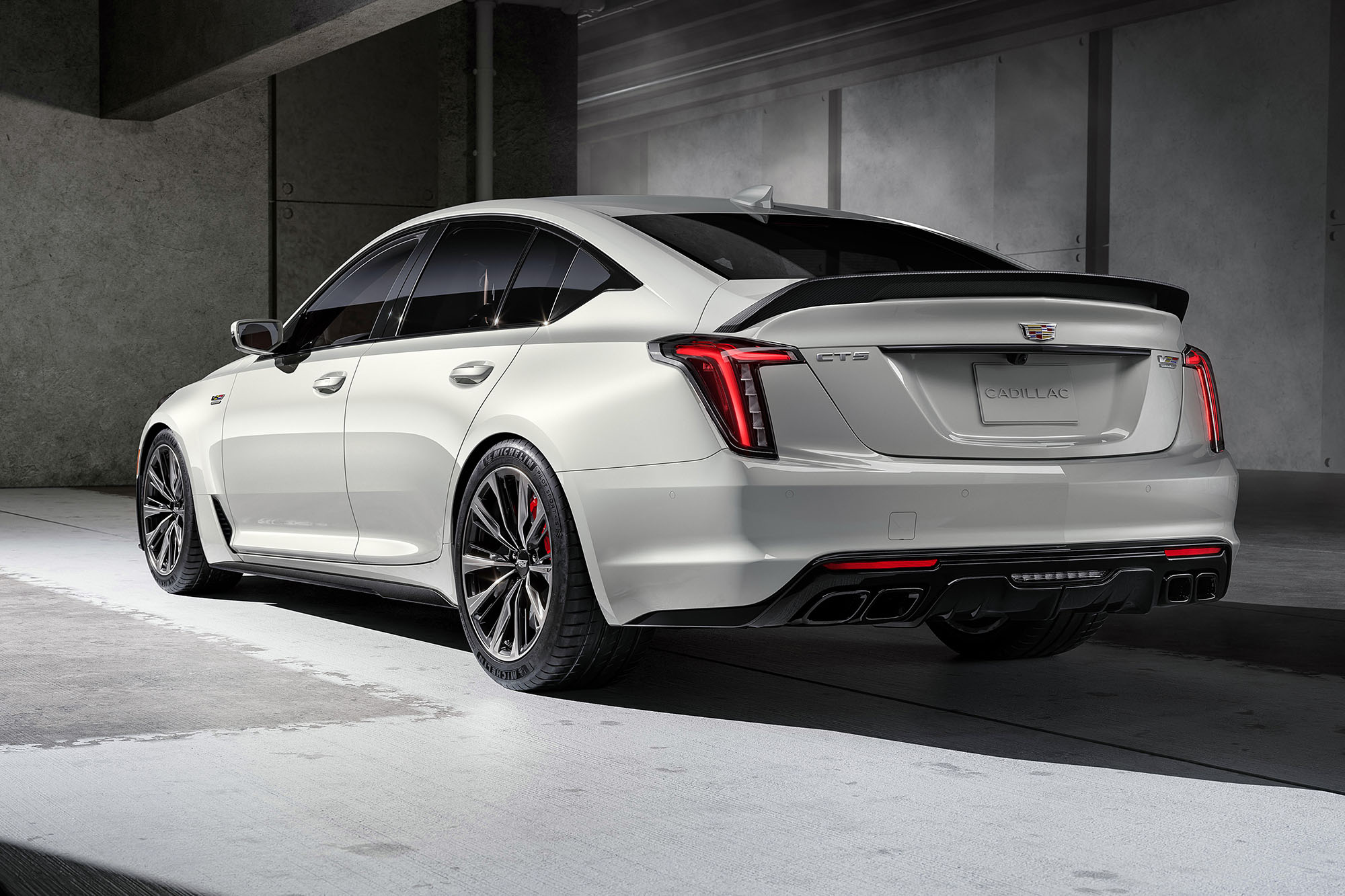 Left rear quarter view of a white 2024 Cadillac CT5-V Blackwing