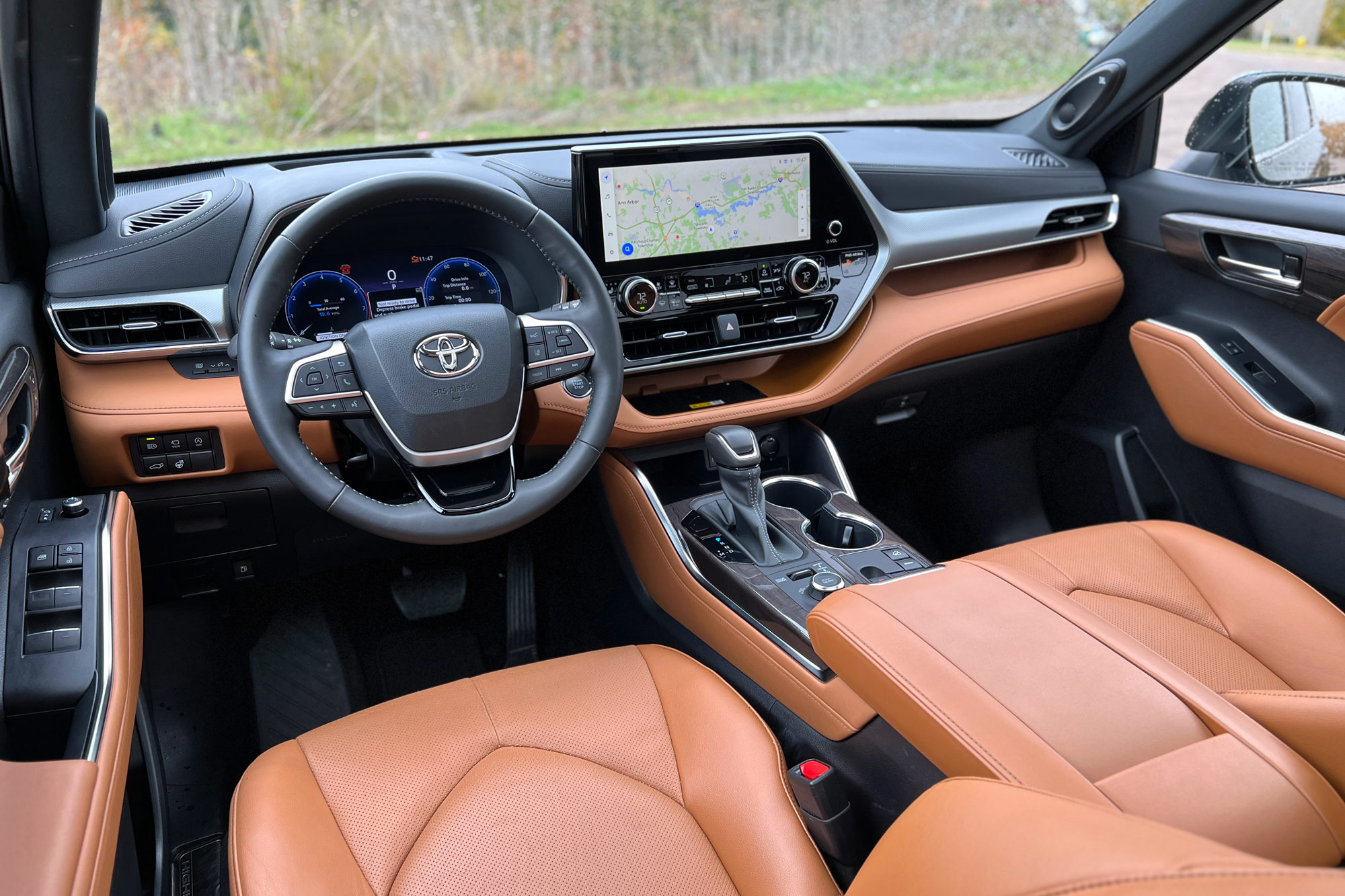 2024 Toyota Highlander front seats and infotainment screen.