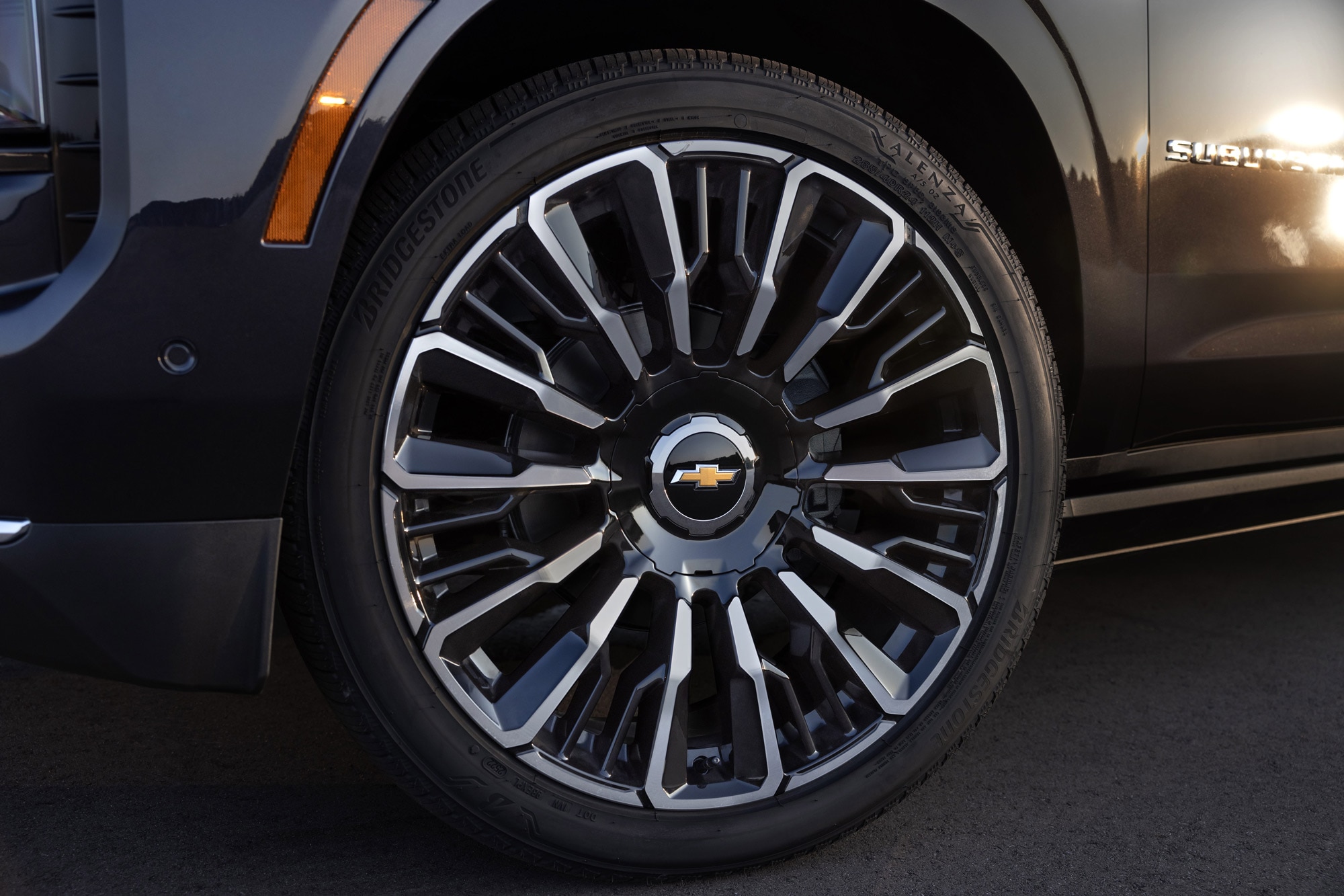 2025 Chevrolet Suburban close up of 24-inch wheels on High Country trim.