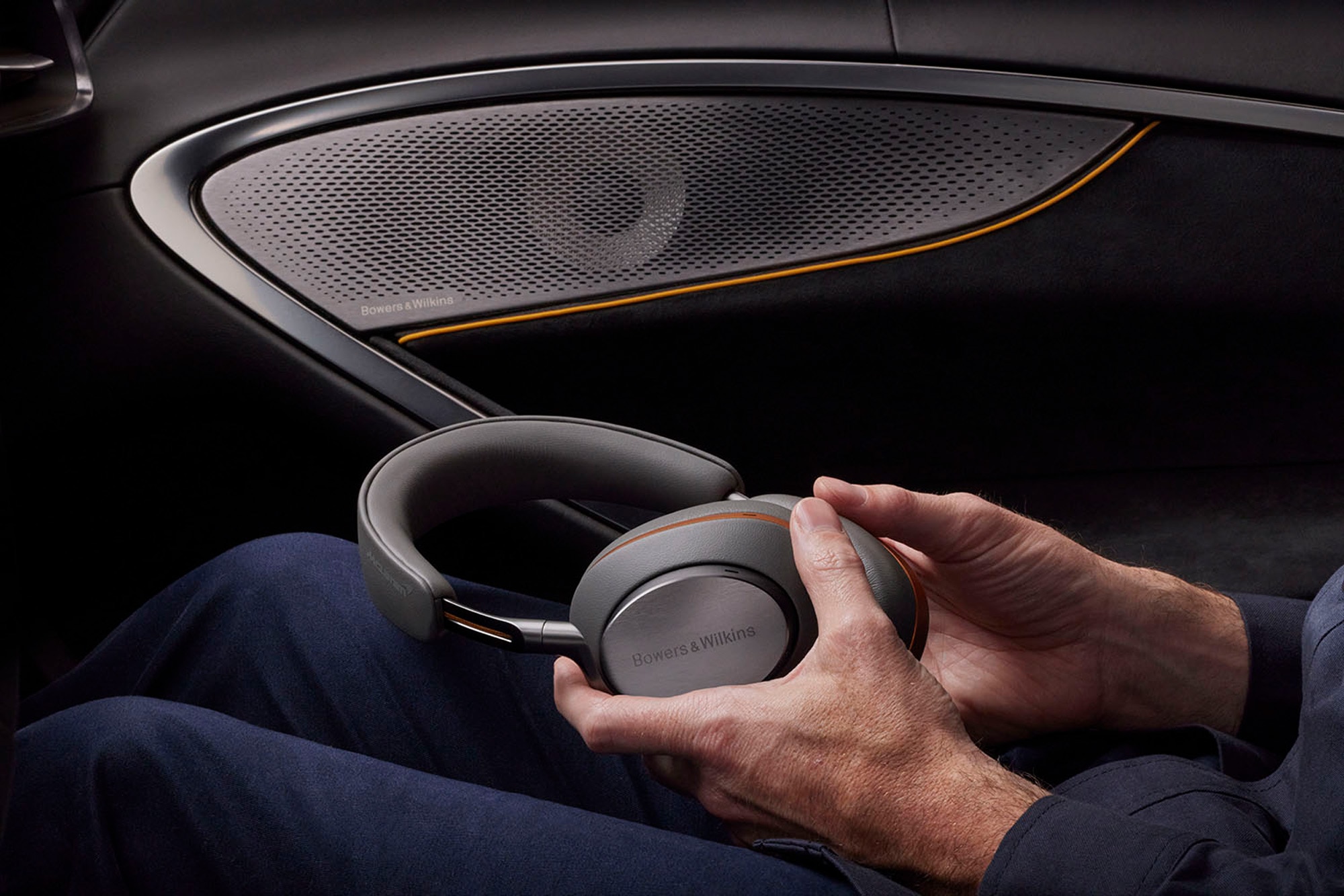 Bowers &amp; WIlkins speaker and headphones in a McLaren
