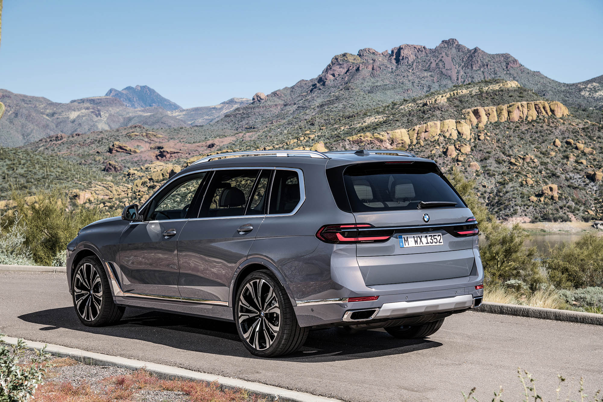 2023 BMW X7 xDrive40i in silver, parked in the desert.