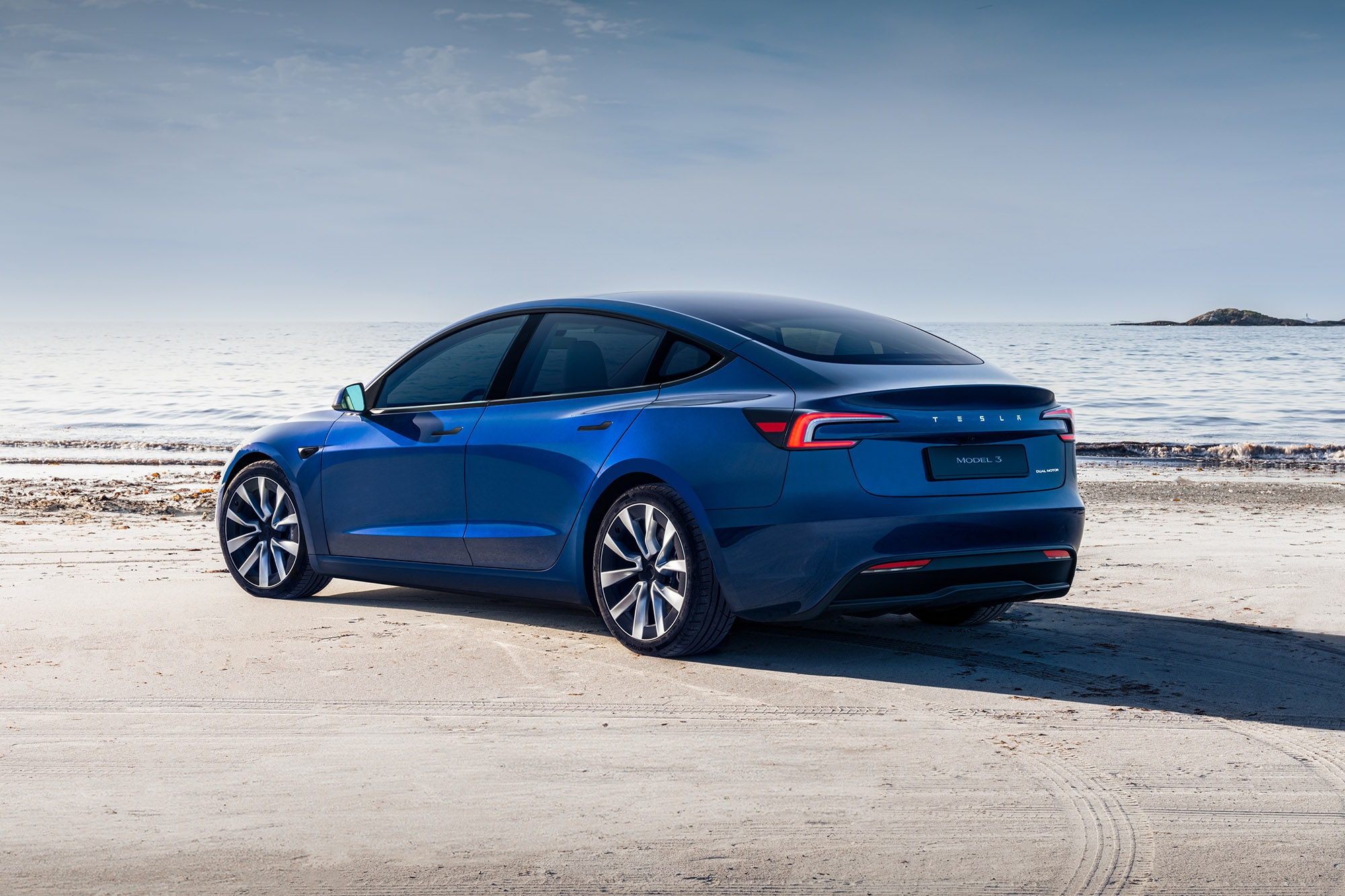 Tesla Model 3 for 2024 in blue, rear