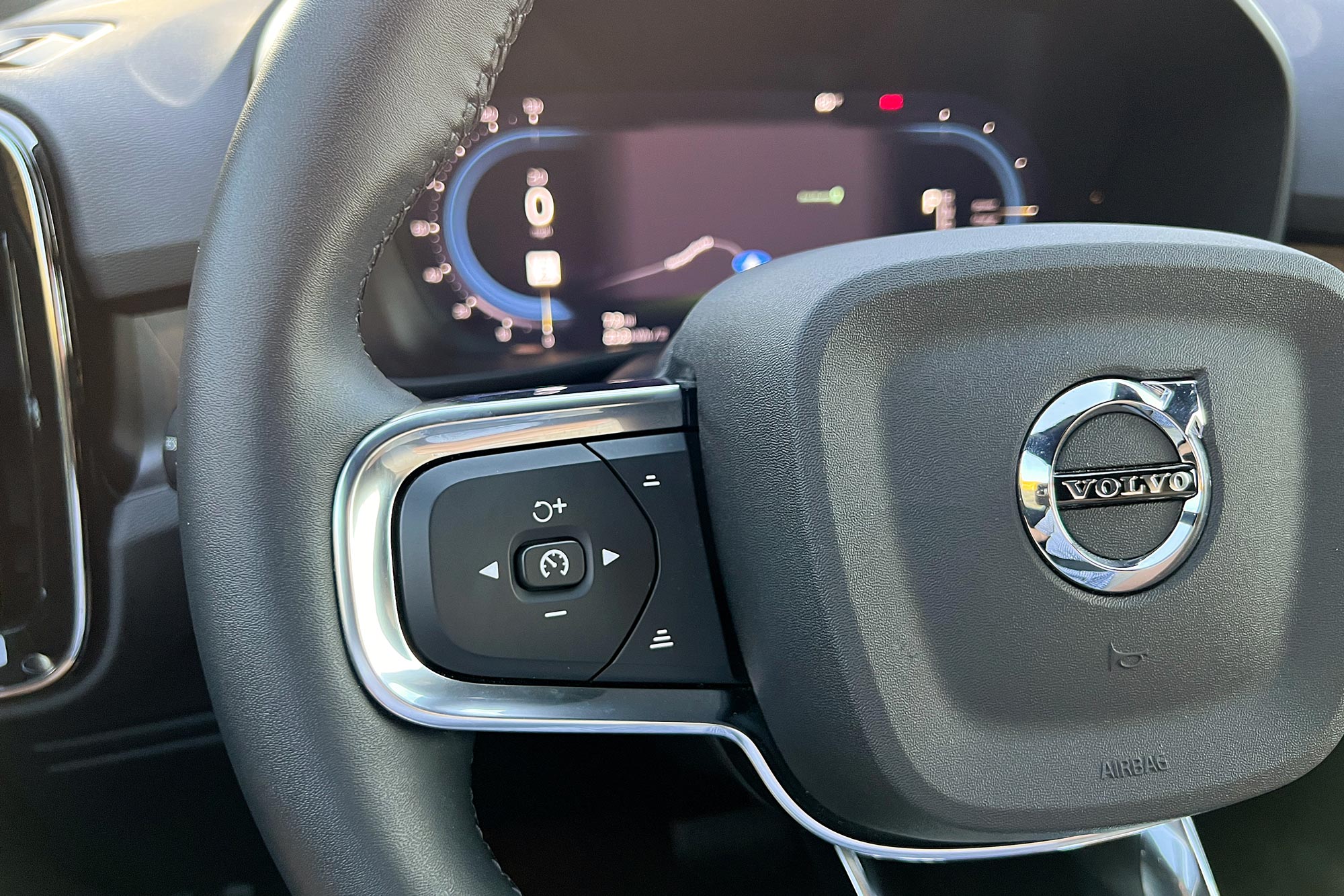 Close up of  2023 Volvo XC40 Recharge steering wheel controls.