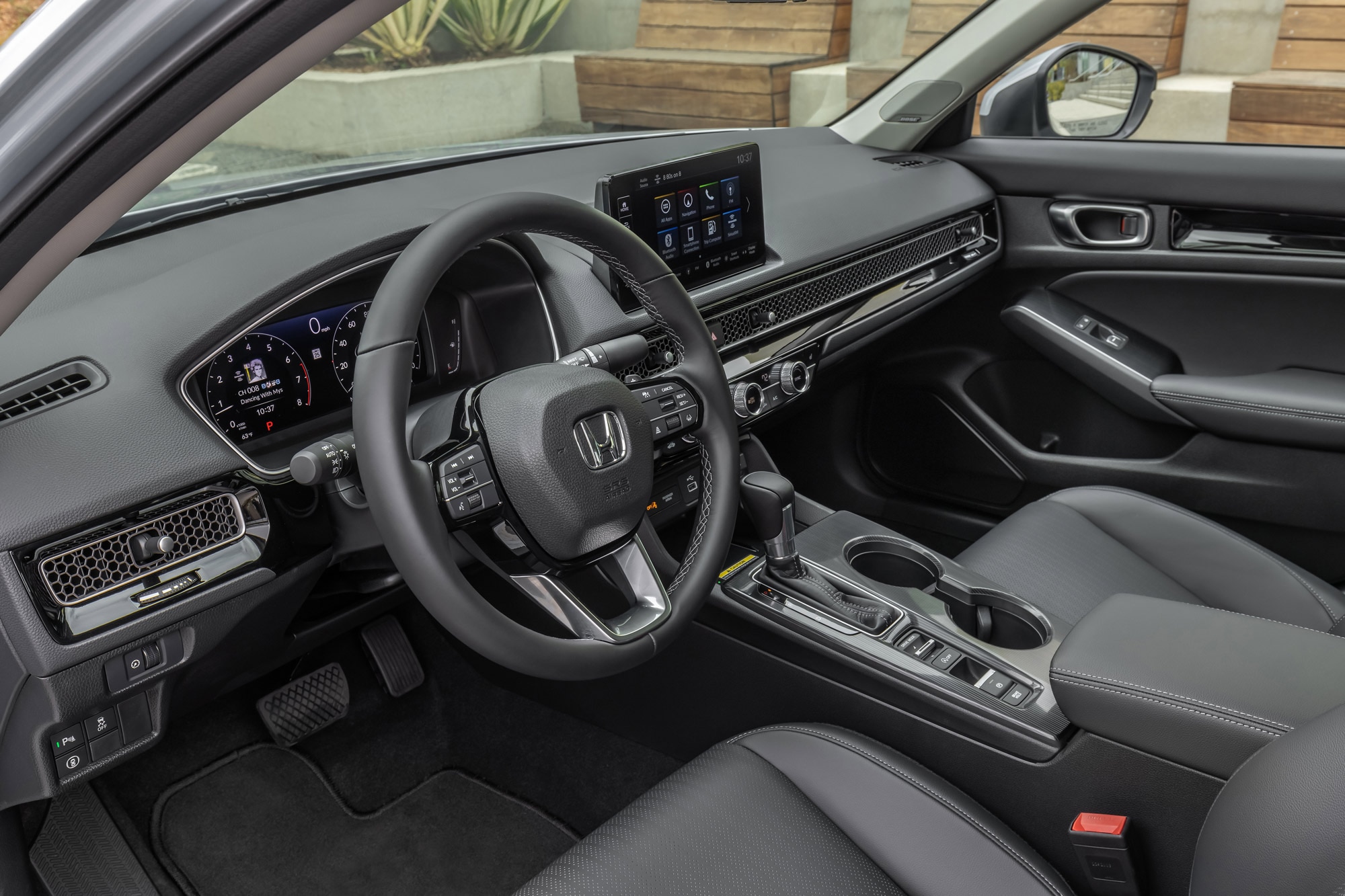 2024 Honda Civic interior steering wheel and infotainment screen.