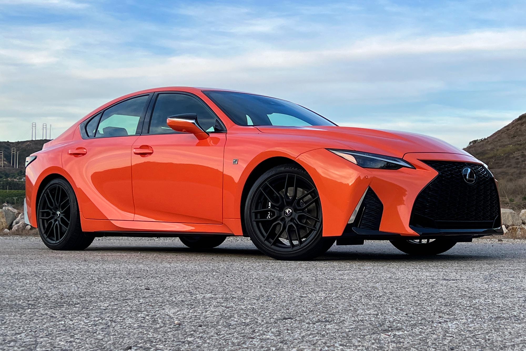 Front right quarter view of an orange 2023 Lexus IS 500