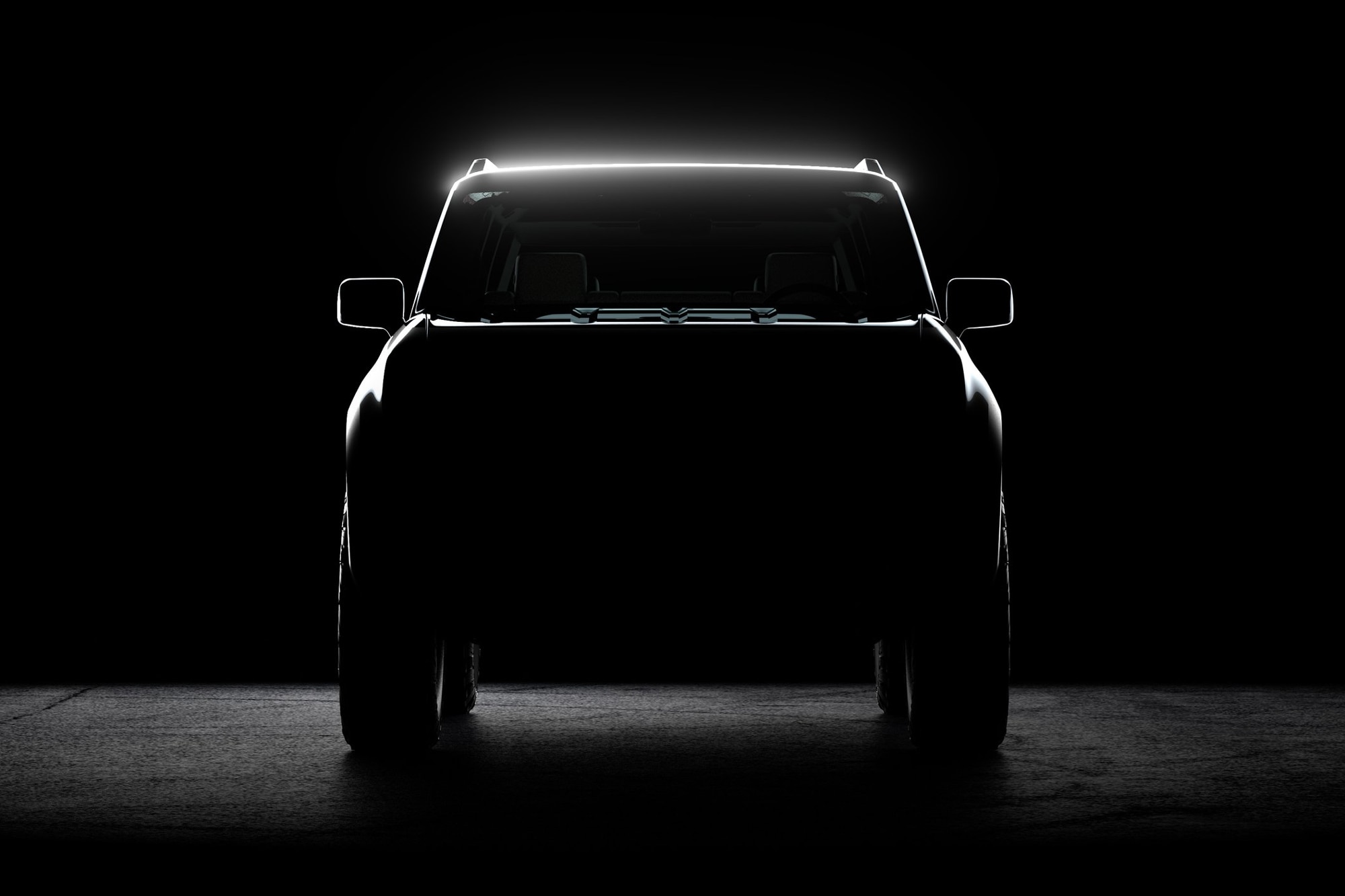 Silhouette of the front end view of a Scout Motors pickup truck.