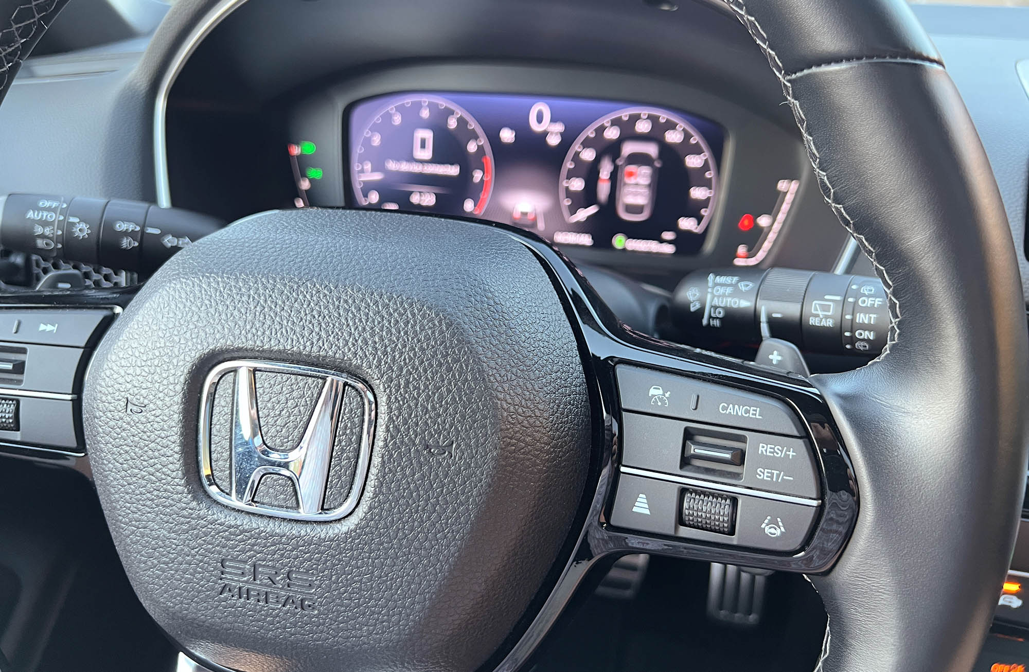 2024 Honda Civic Hatchback safety feature controls on steering wheel
