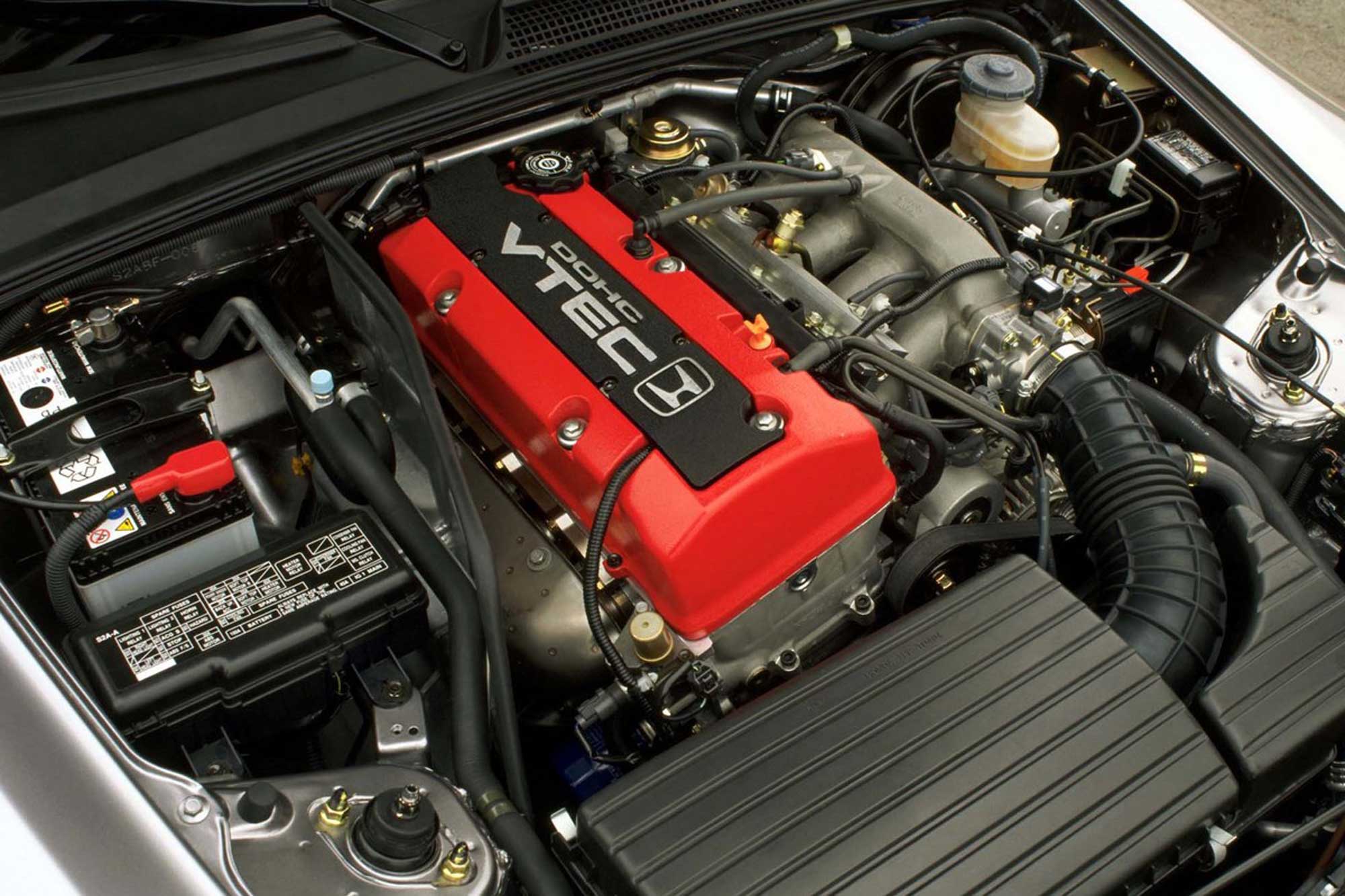 Honda engine with prominent VTEC markings on engine cover.