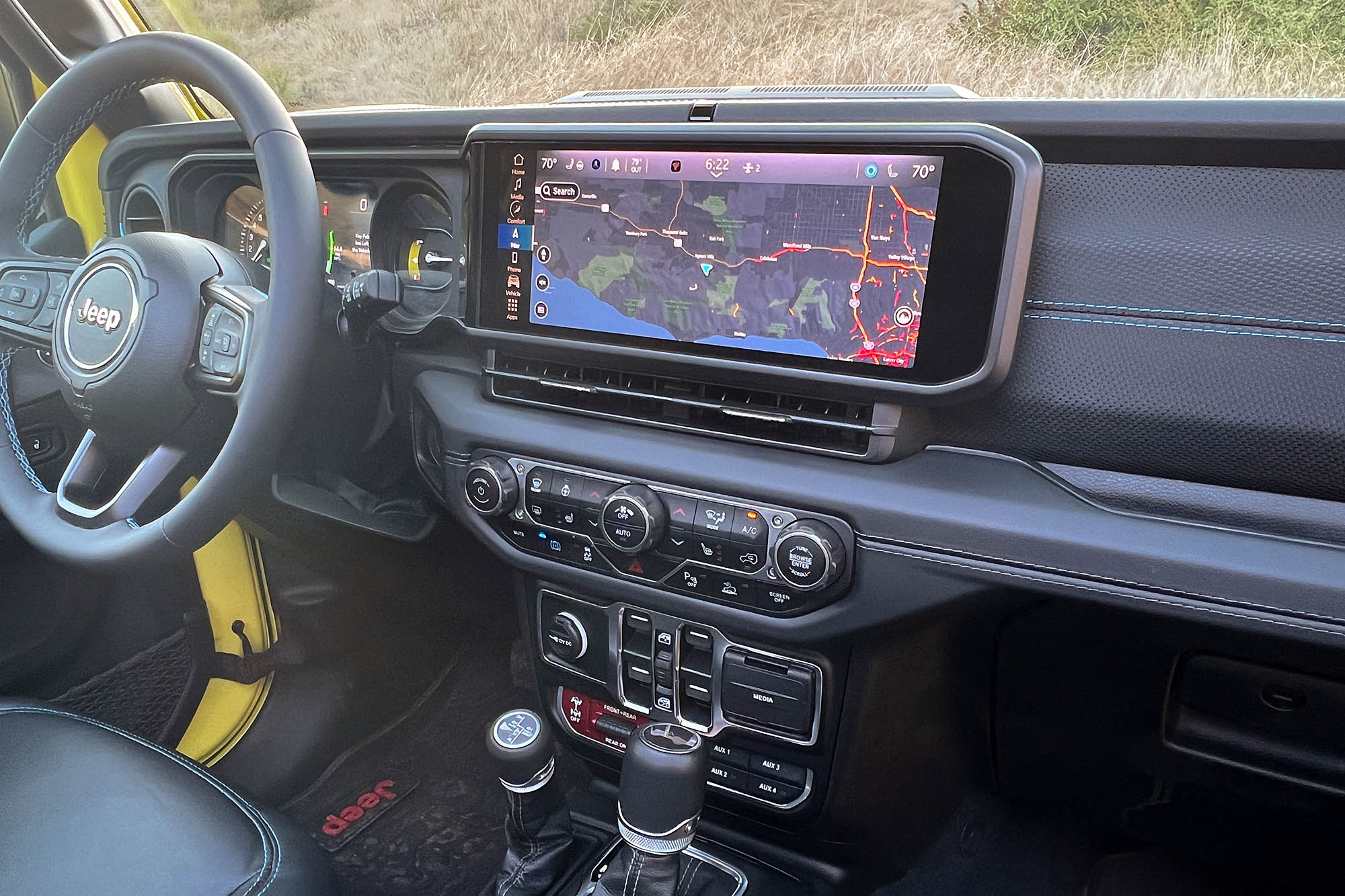 The infotainment screen in a 2024 Jeep Wrangler Rubicon 4xe displaying a map 