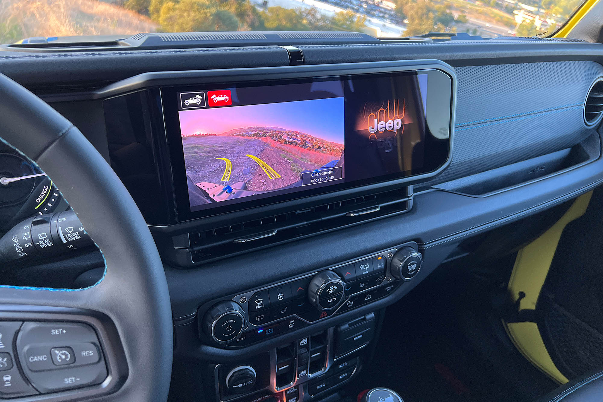 The infotainment screen of a 2024 Jeep Wrangler Rubicon 4xe showing the front-view camera