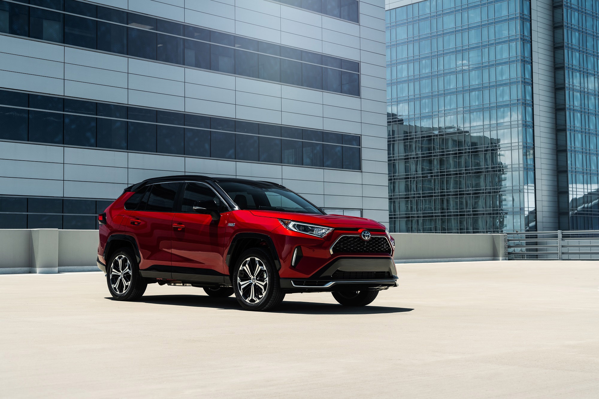 2023 Toyota RAV4 Prime XSE in Supersonic Red with the Midnight Black Metallic roof.