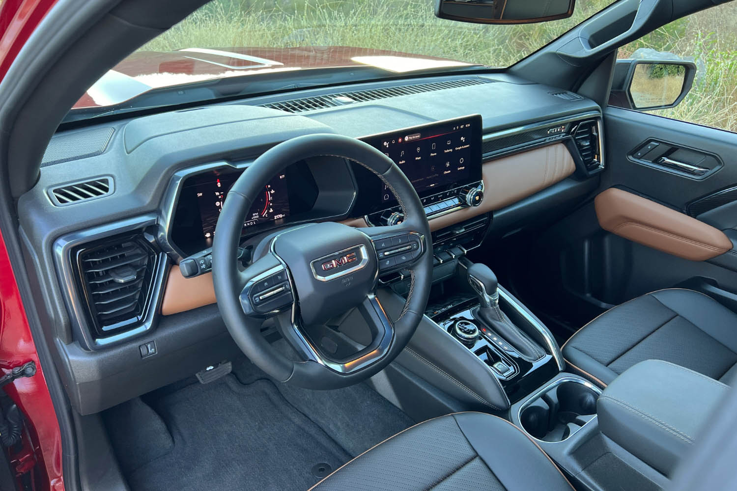 Front seats and dashboard view of a 2023 GMC Canyon