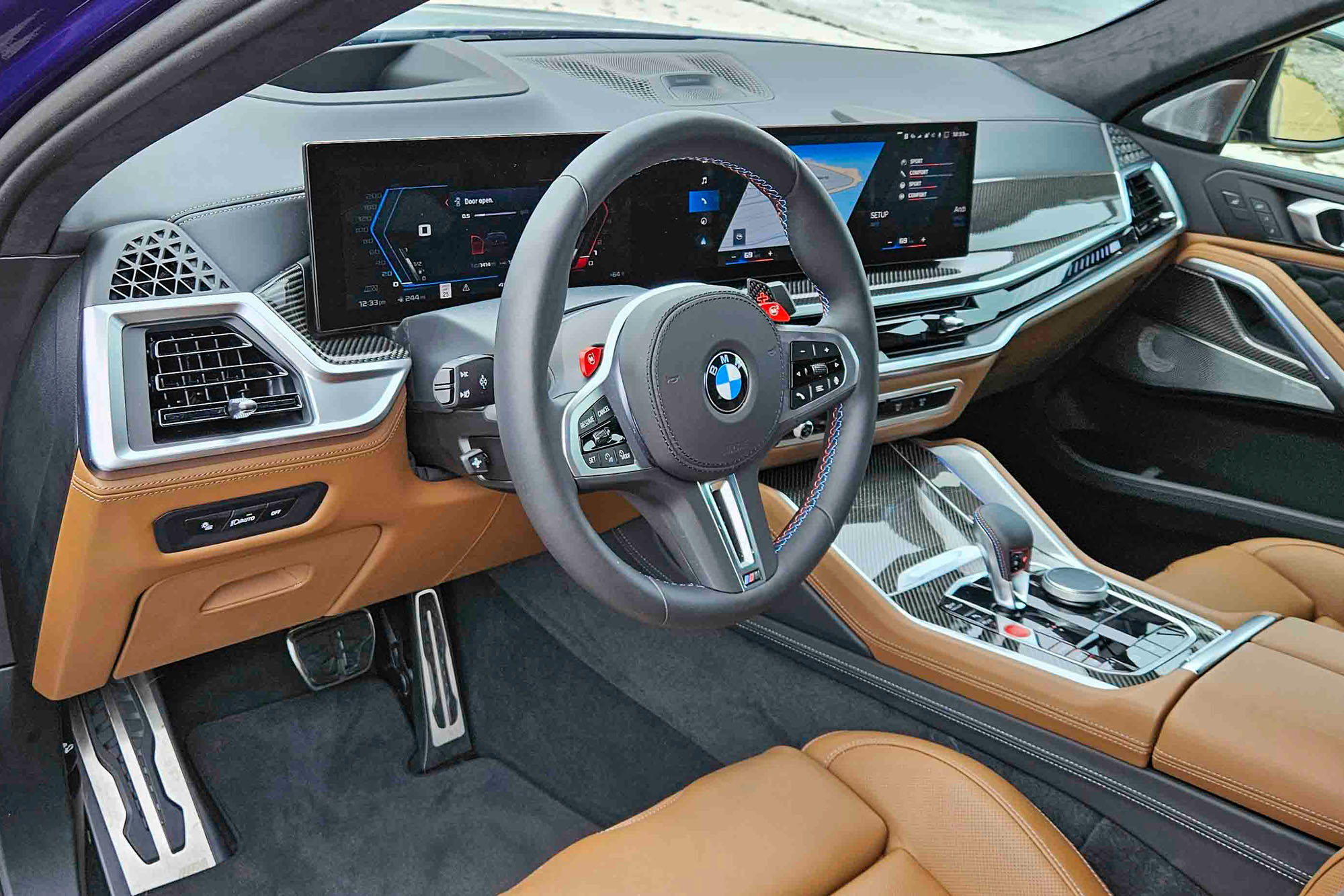 Front seats and dashboard of a 2024 BMW X6 M