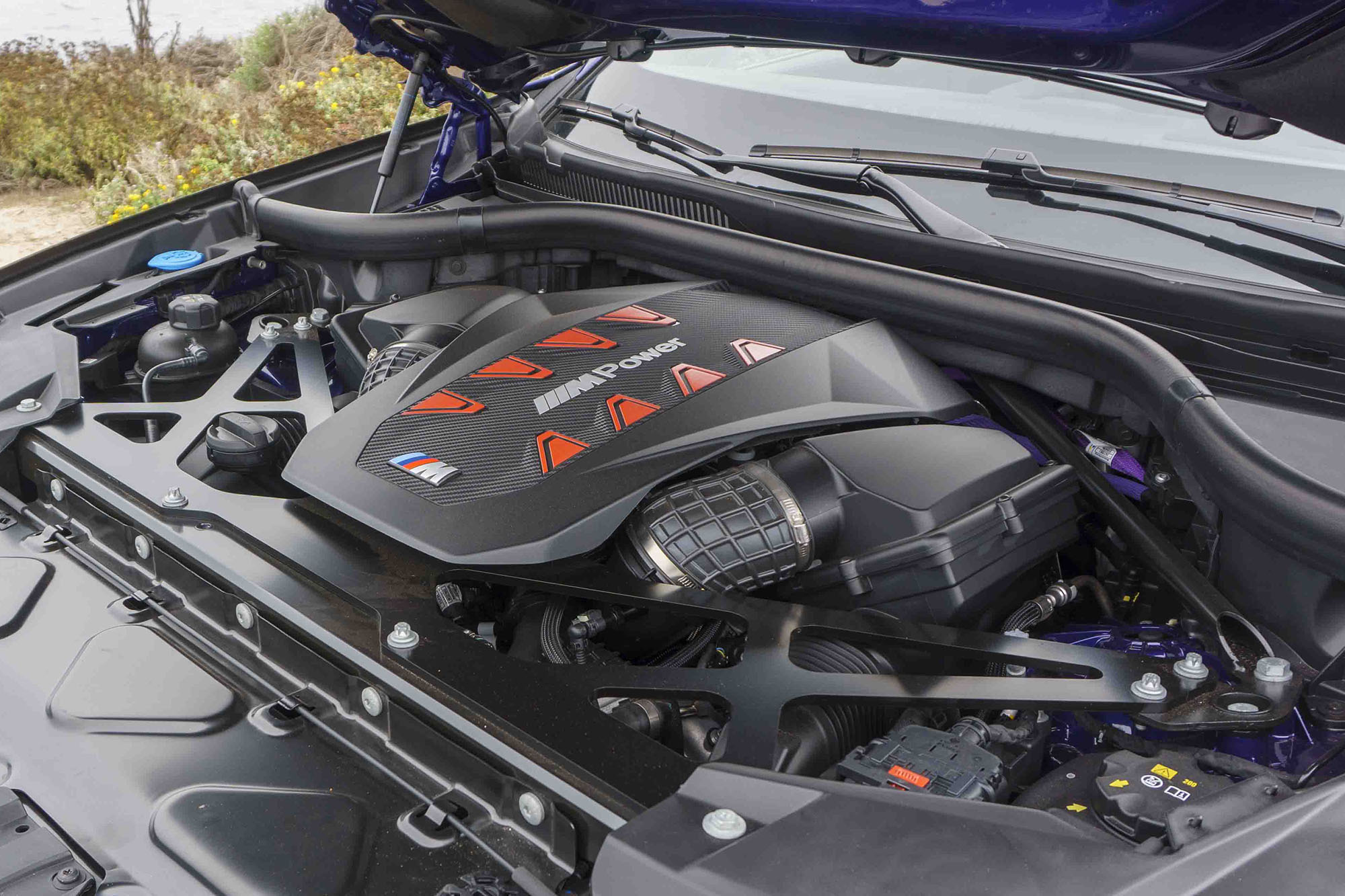 The engine bay of a 2024 BMW X6 M