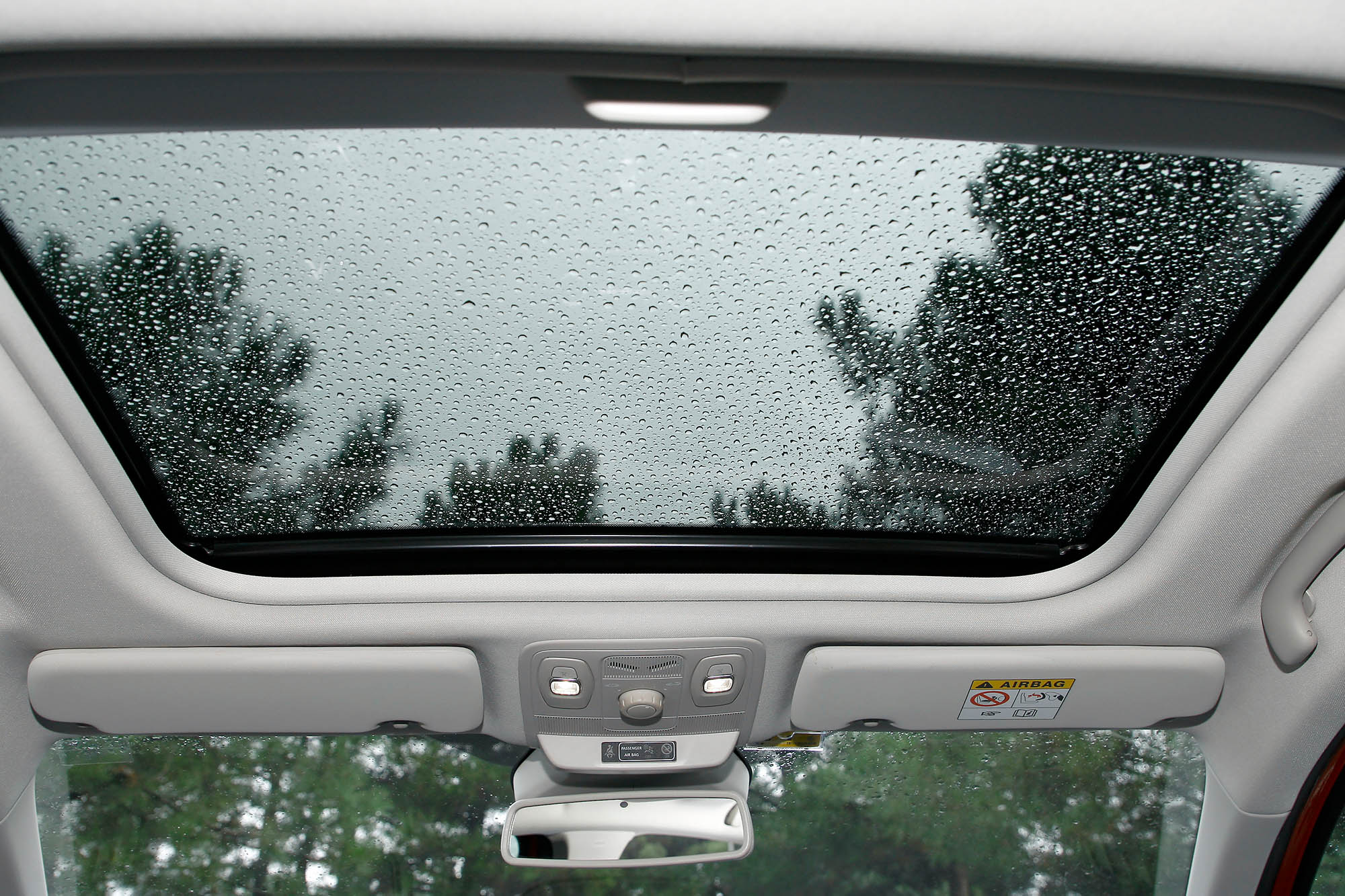 Vehicle sunroof with raindrops on it