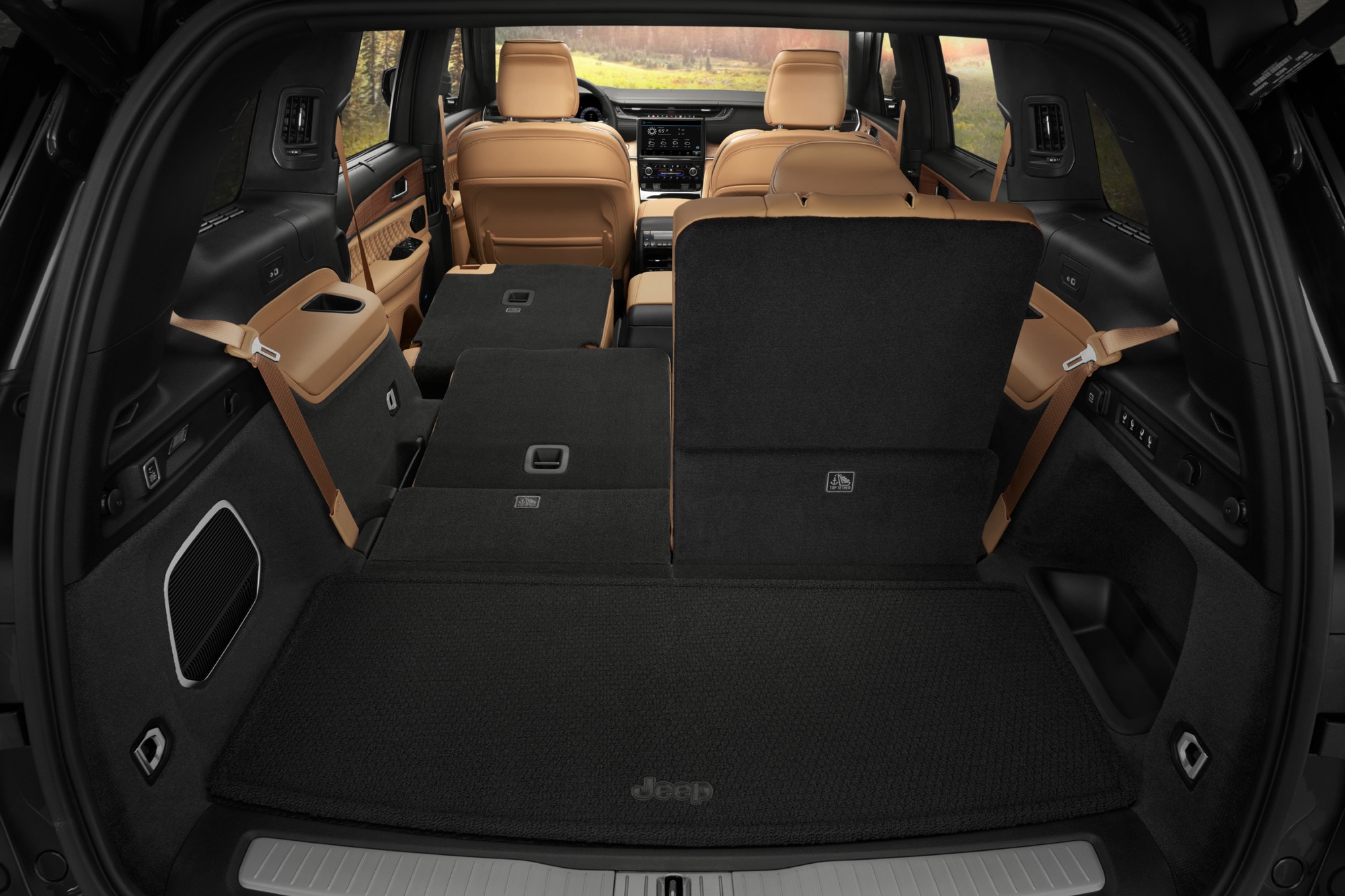 2023 Jeep Grand Cherokee L Summit Reserve cargo space and brown interior with seats down