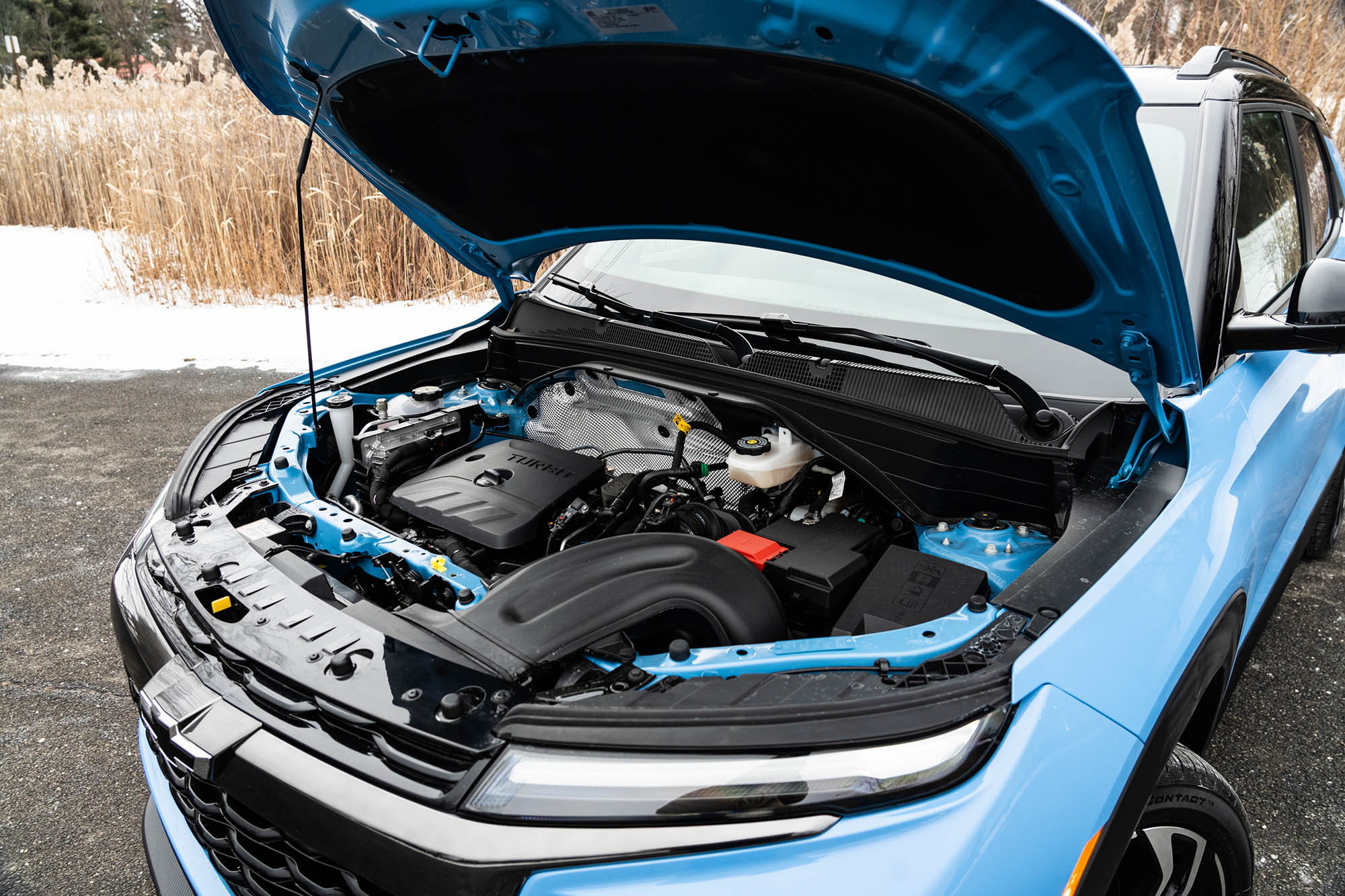 The engine bay of a blue 2024 Chevrolet Trailblazer