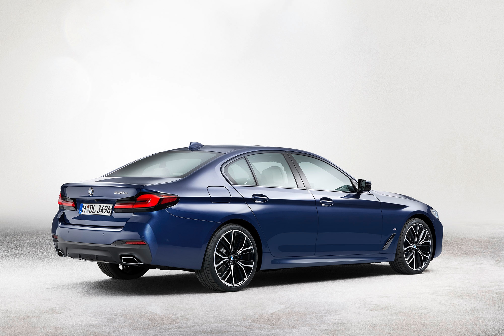 BMW 5 Series in blue, rear