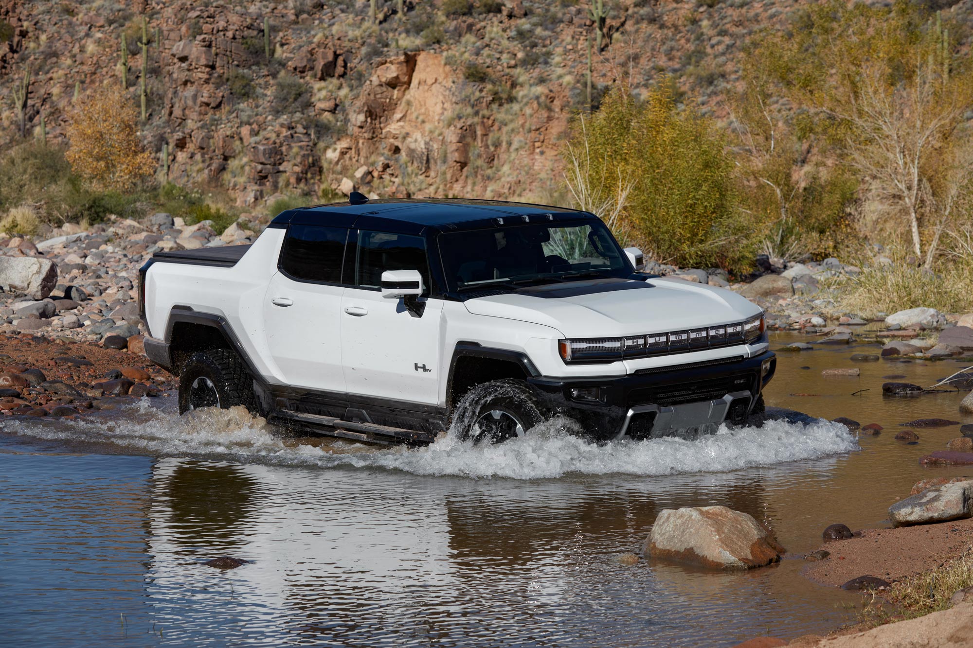2024 GMC Hummer EV Pickup fords a body of water.