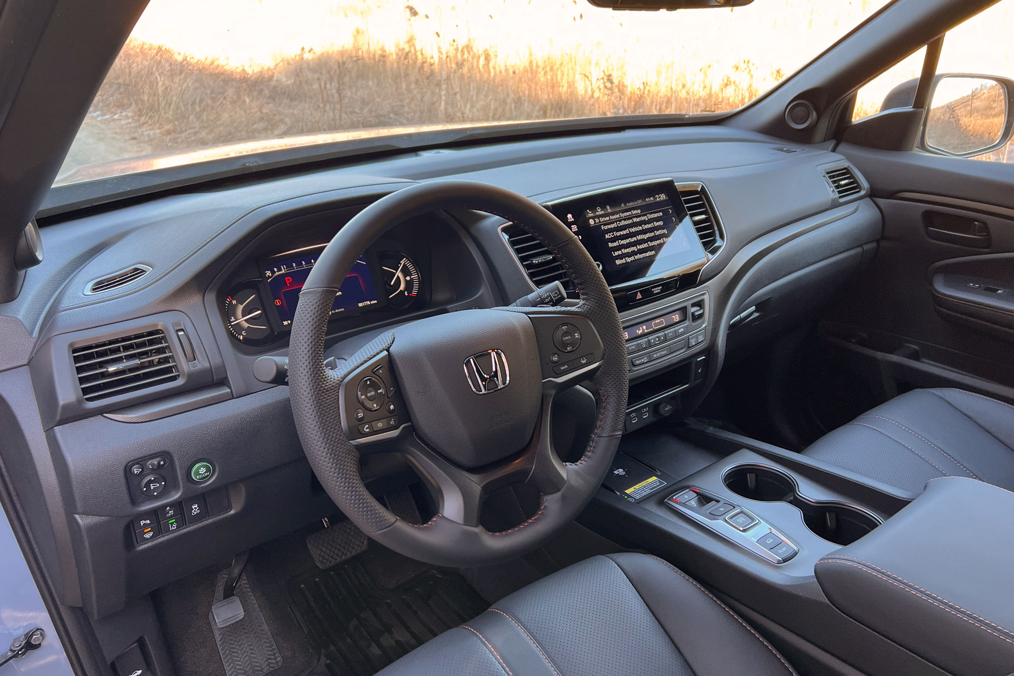 2024 Honda Passport TrailSport interior and steering wheel.