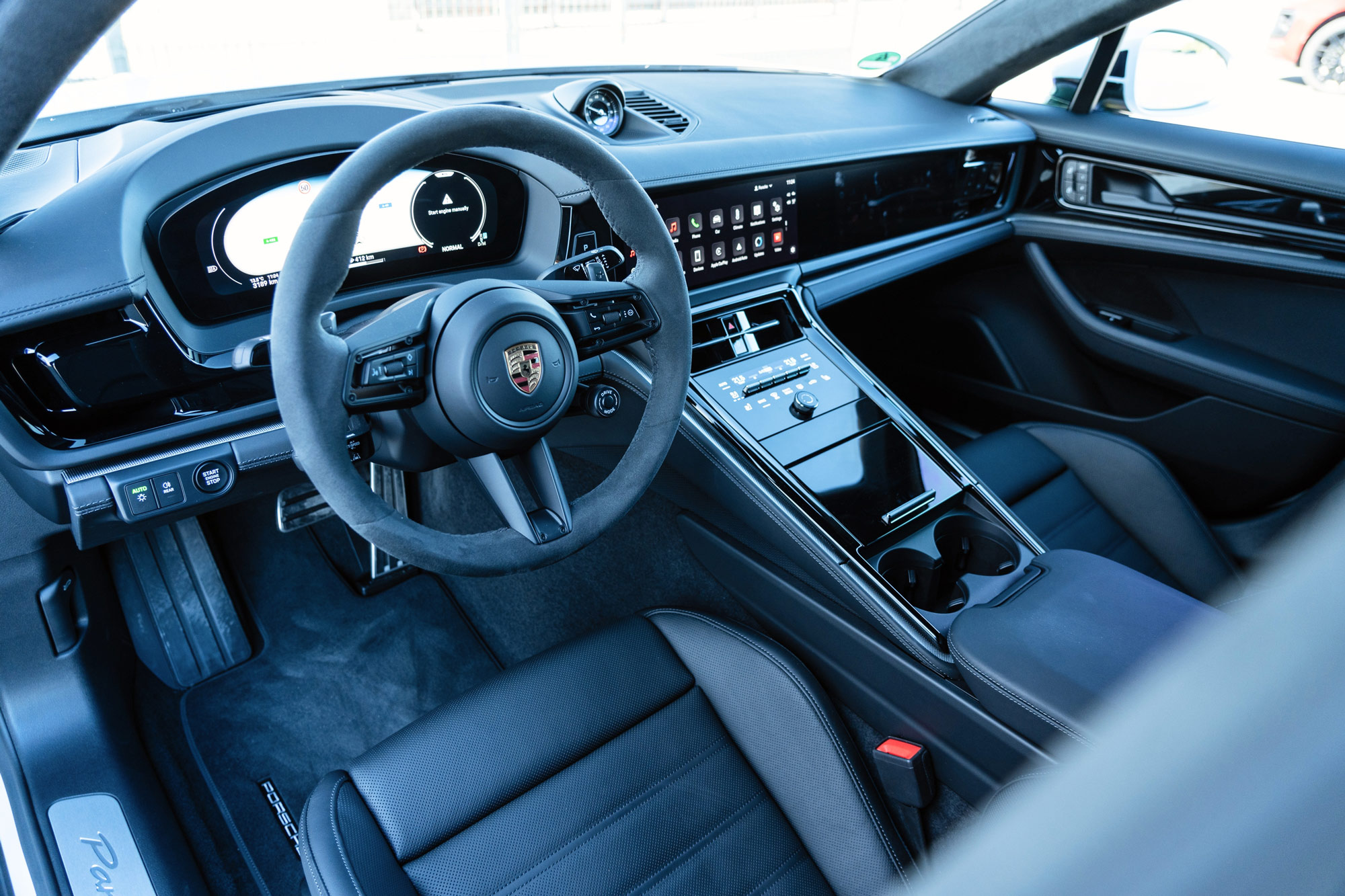 2024 Porsche Panamera interior, dashboard, and black leather front seats