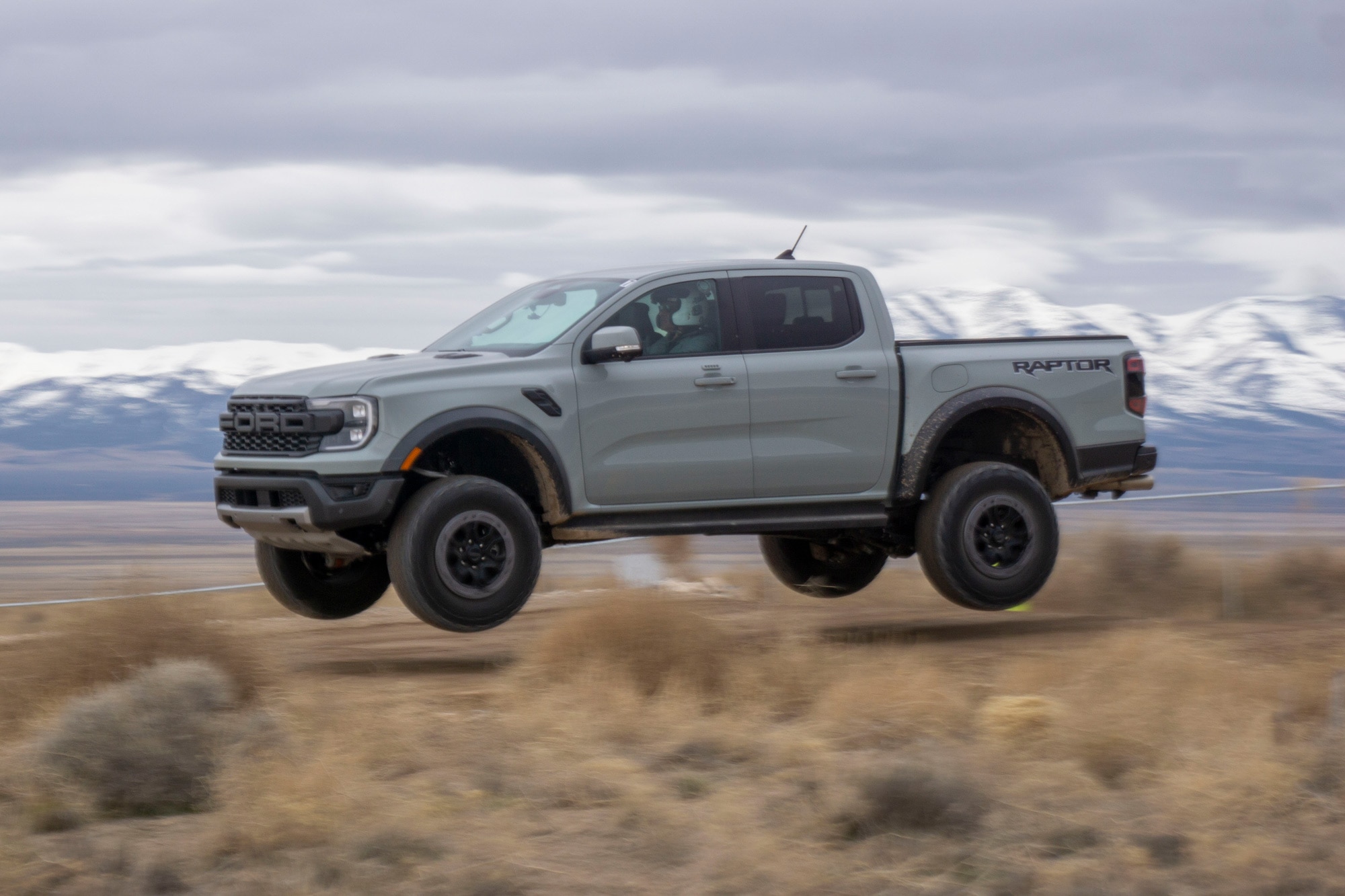 2024 Ford Ranger Raptor jumps a hill in the desert
