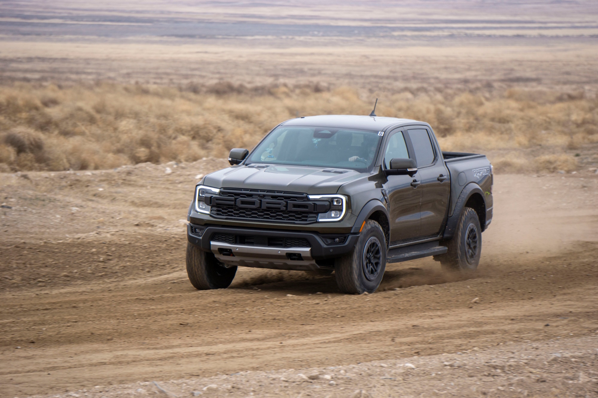 2024 Ford Ranger Raptor driving on dirt course