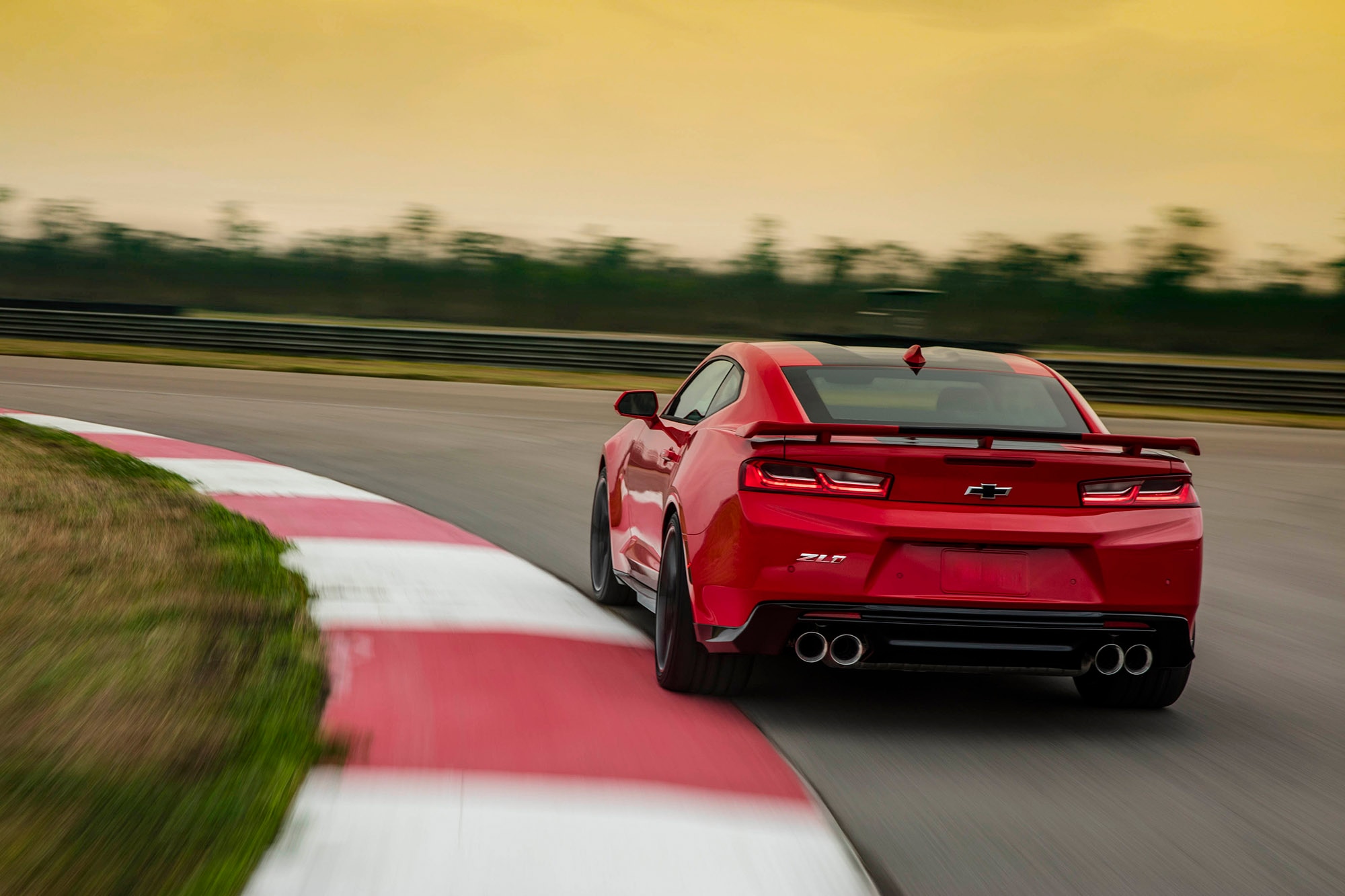 Red ZL1 Camaro driving on race track