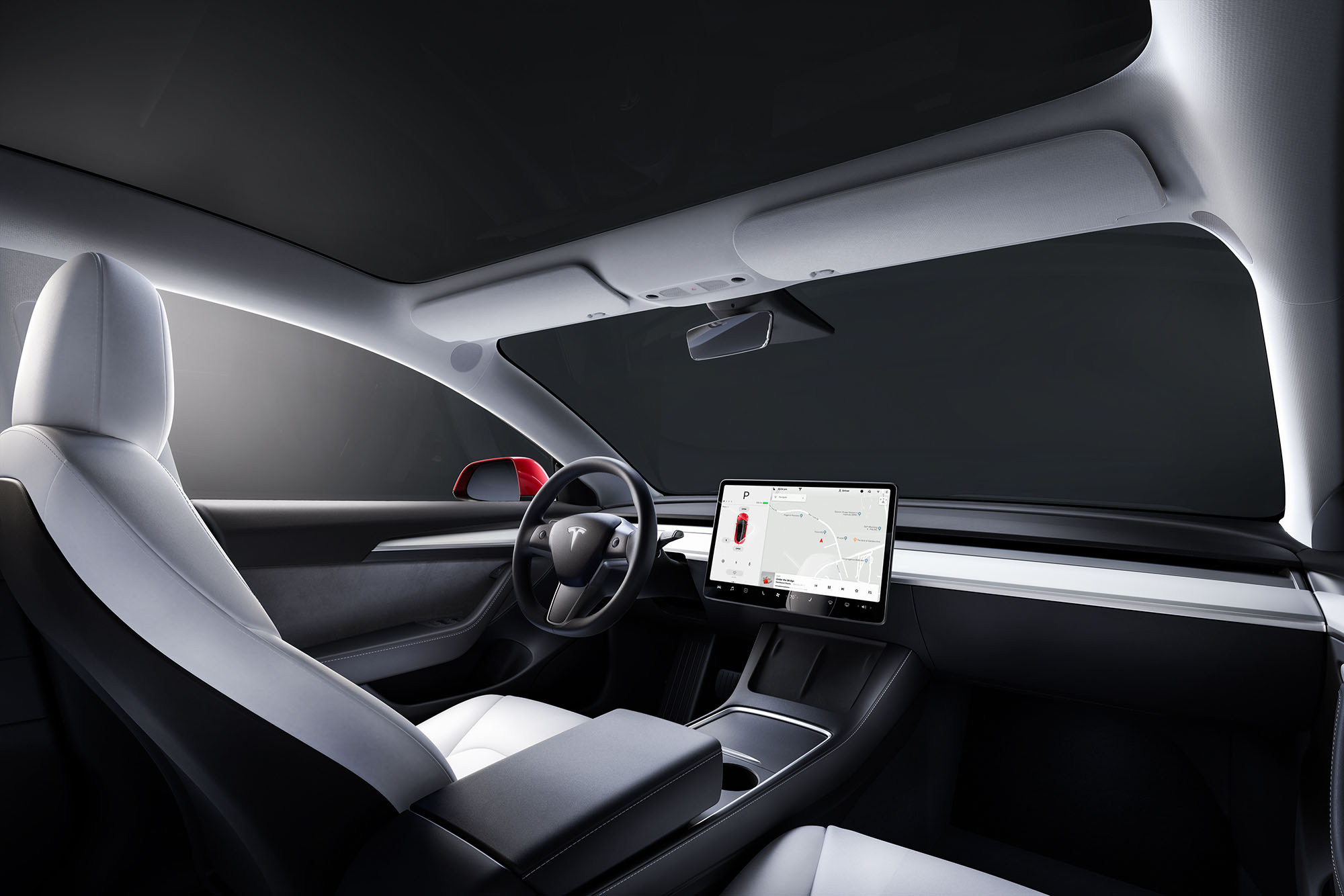 Steering wheel, dashboard, and driver's seat in Tesla Model 3