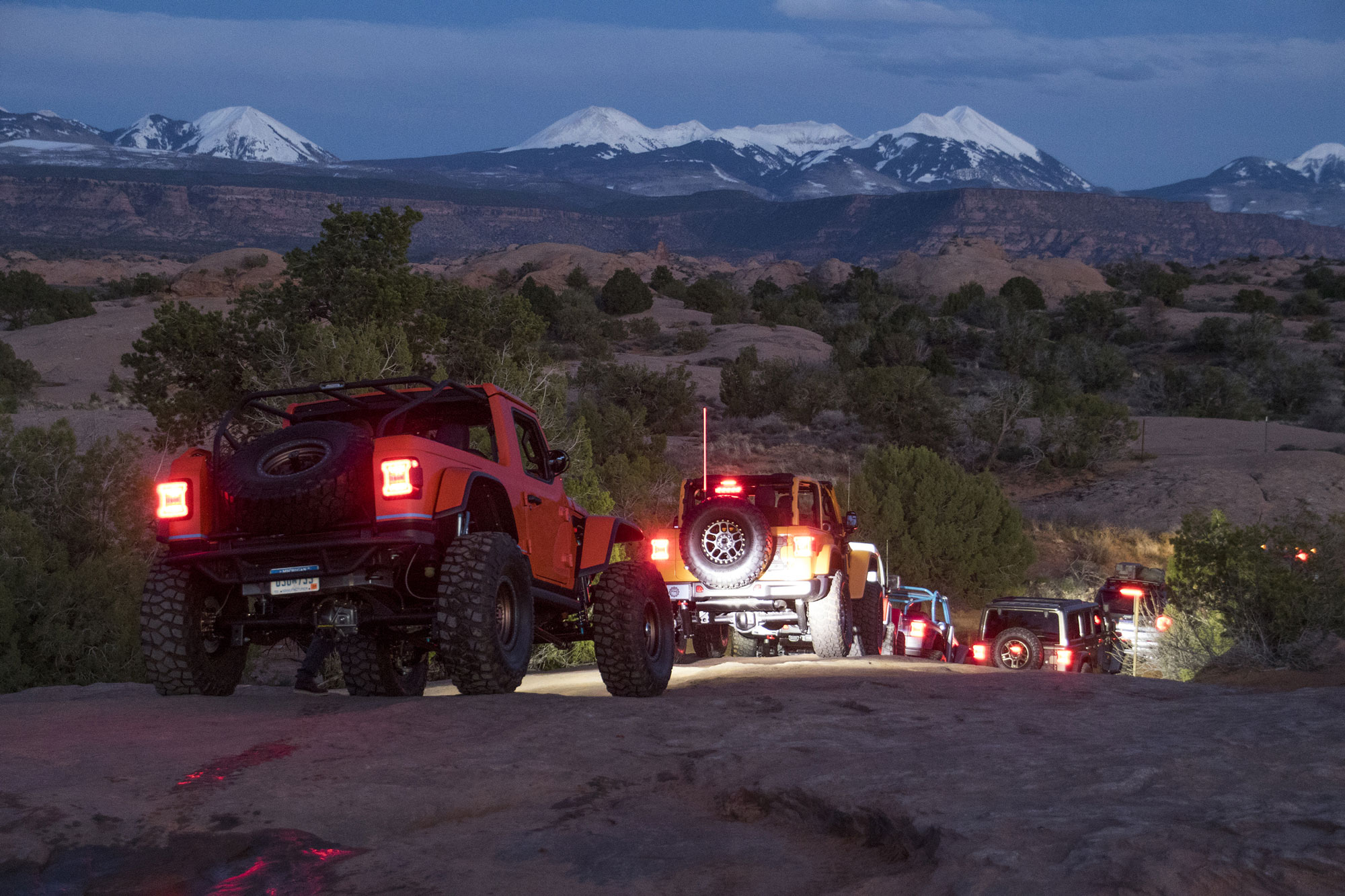 Several Jeeps traverse off-road near Moab