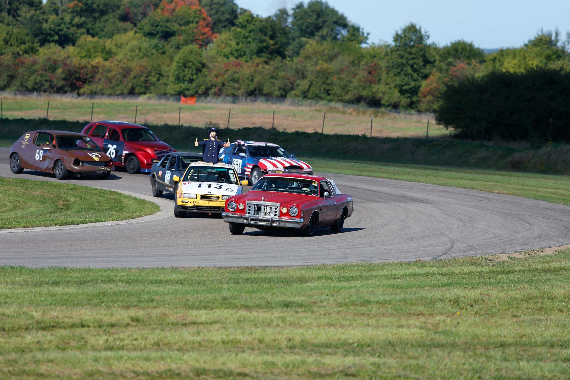 Race cars on track at the 24 Hours of Lemons