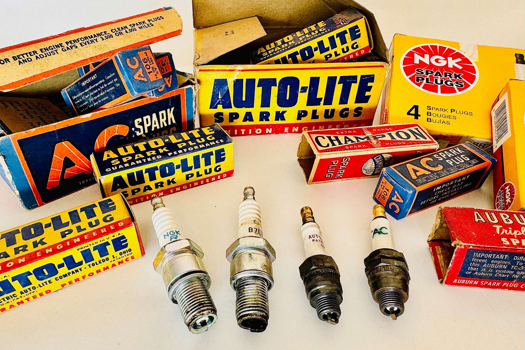 Several spark plugs and spark plug boxes