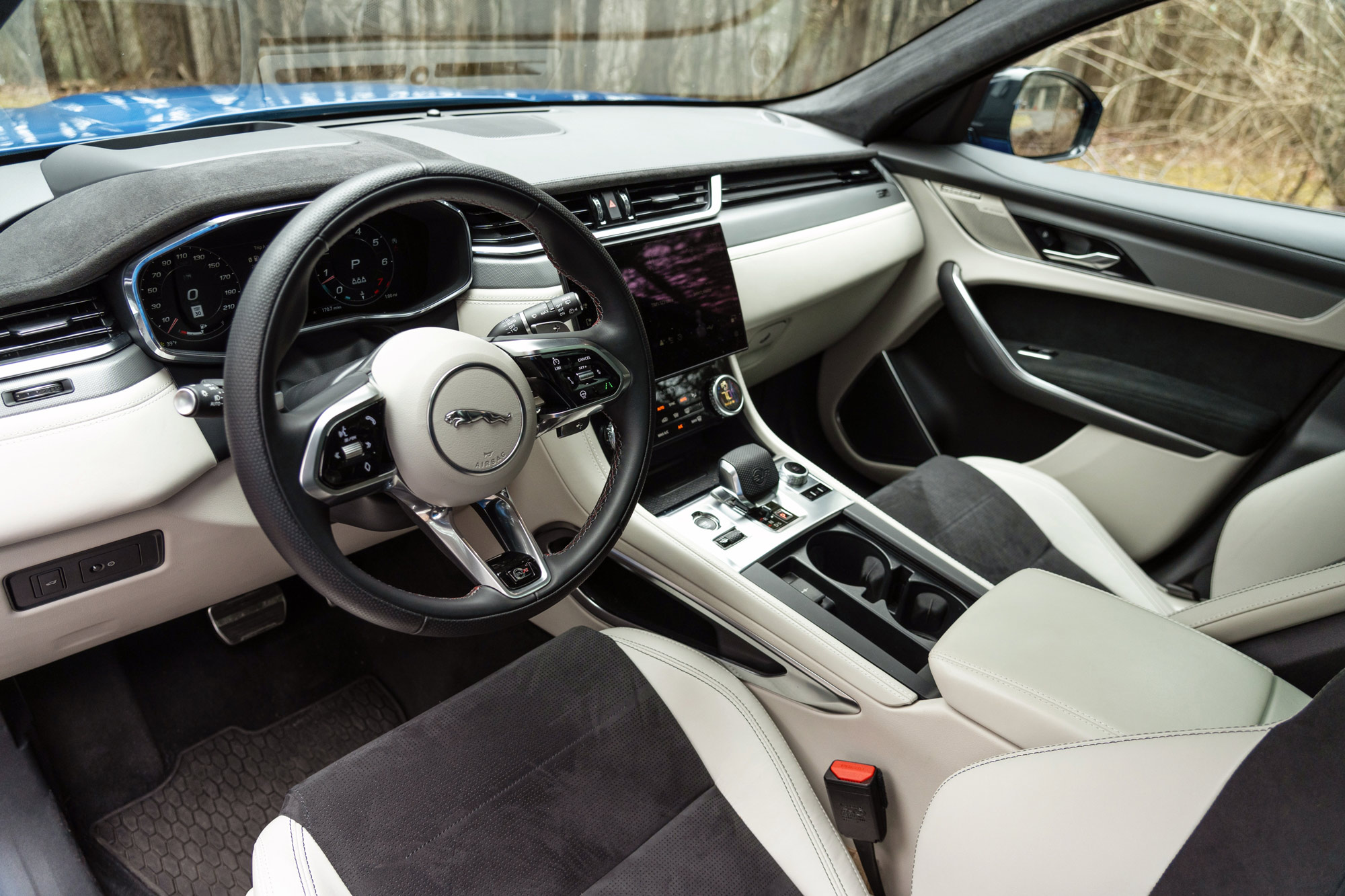 2024 Jaguar F-Pace SVR interior showing the dashboard and front seats.
