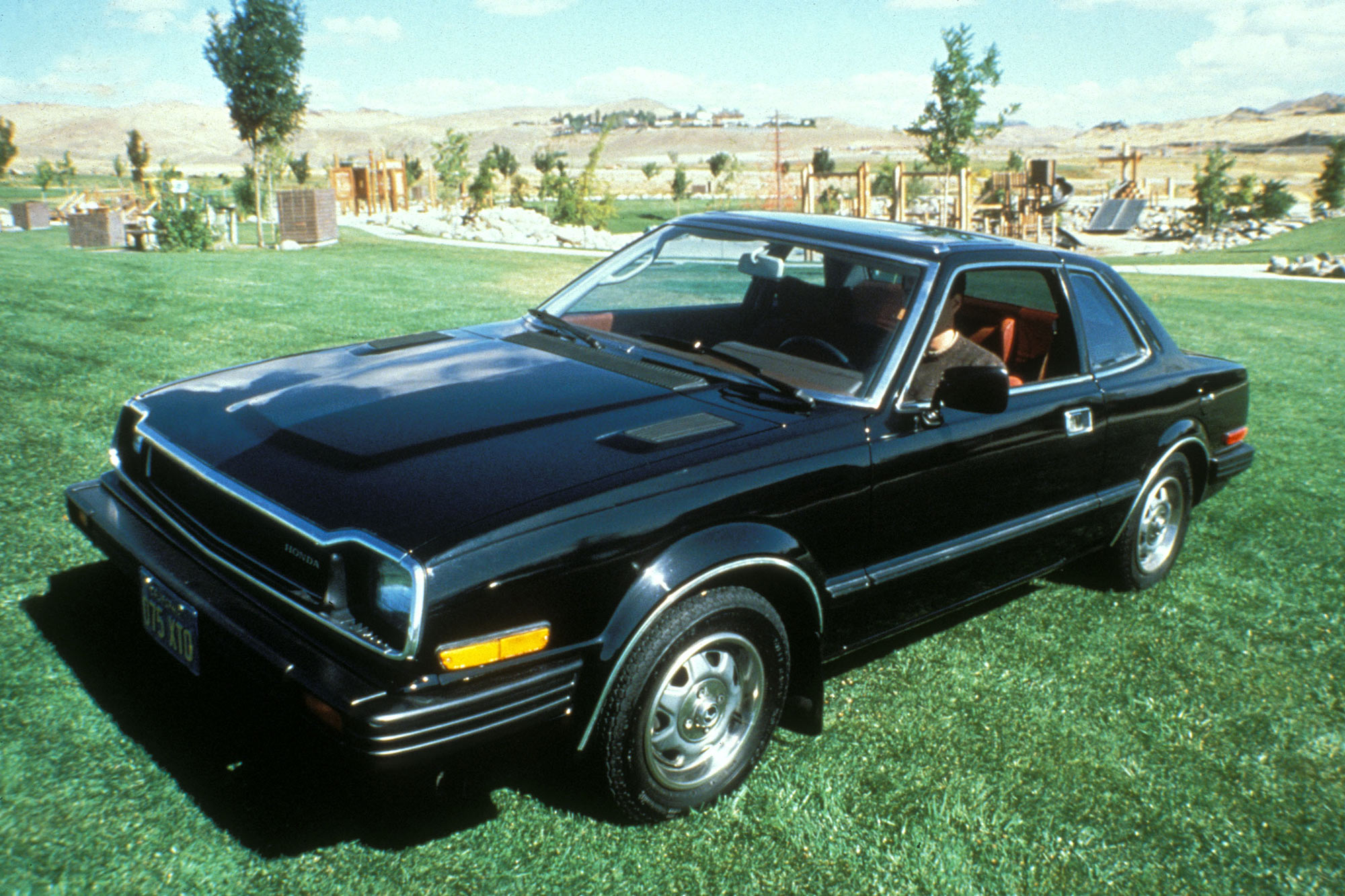 Black 1979 Honda Prelude parked on the grass