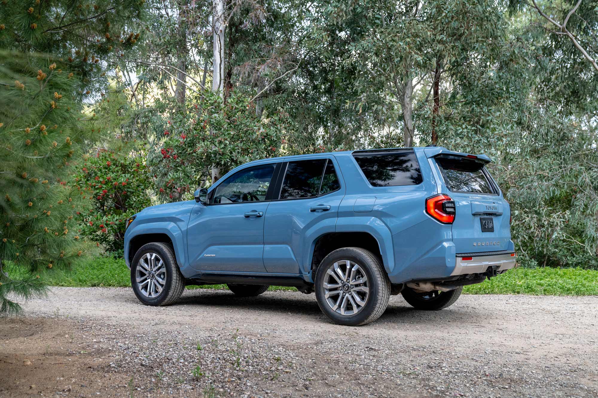 2025 Toyota 4Runner in blue parked on gravel road.