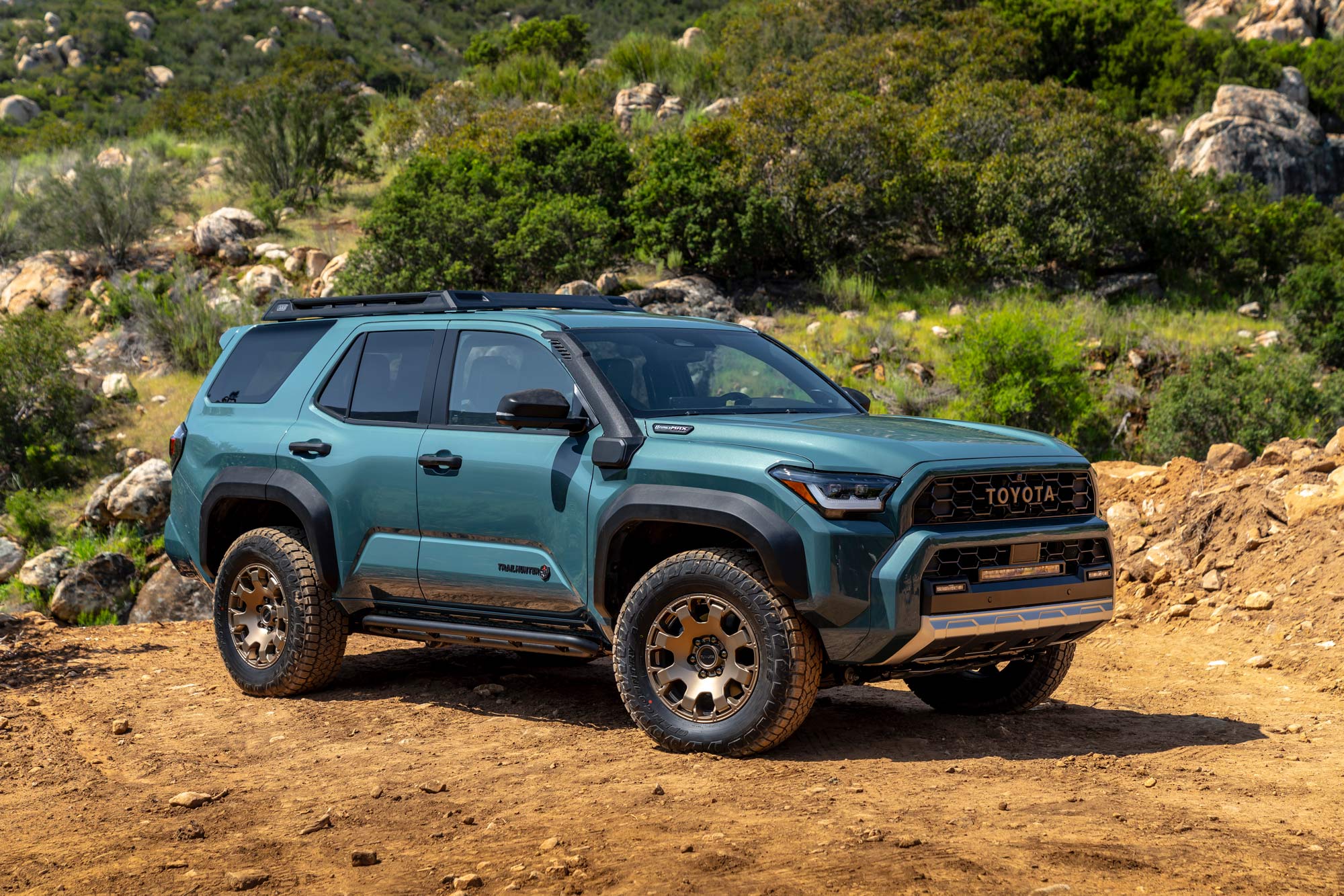 2025 Toyota 4Runner Trailhunter parked on dirt in mountains.