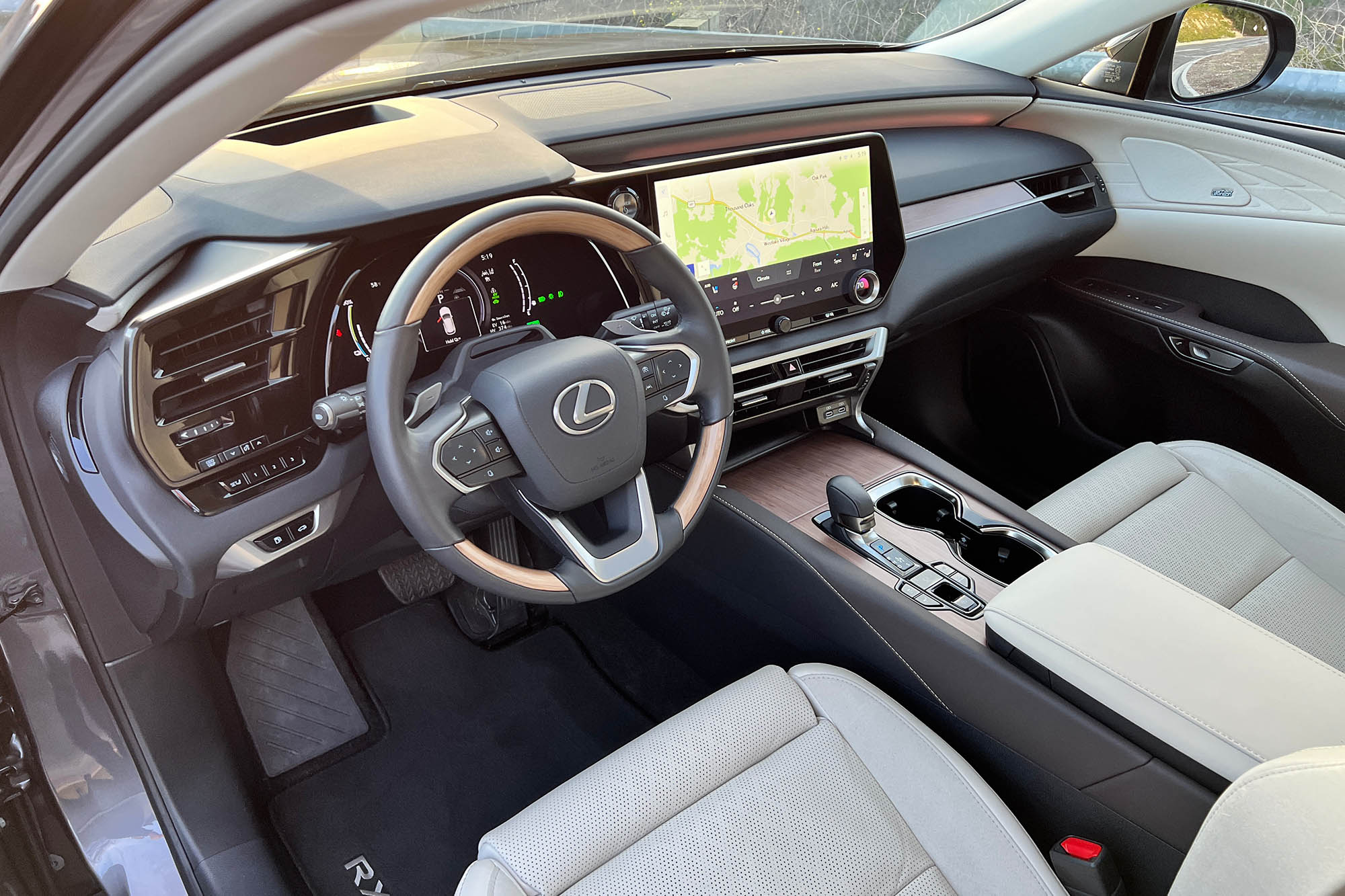 View of the dashboard and front seats in a 2024 Lexus RX 450h+ plug-in hybrid.